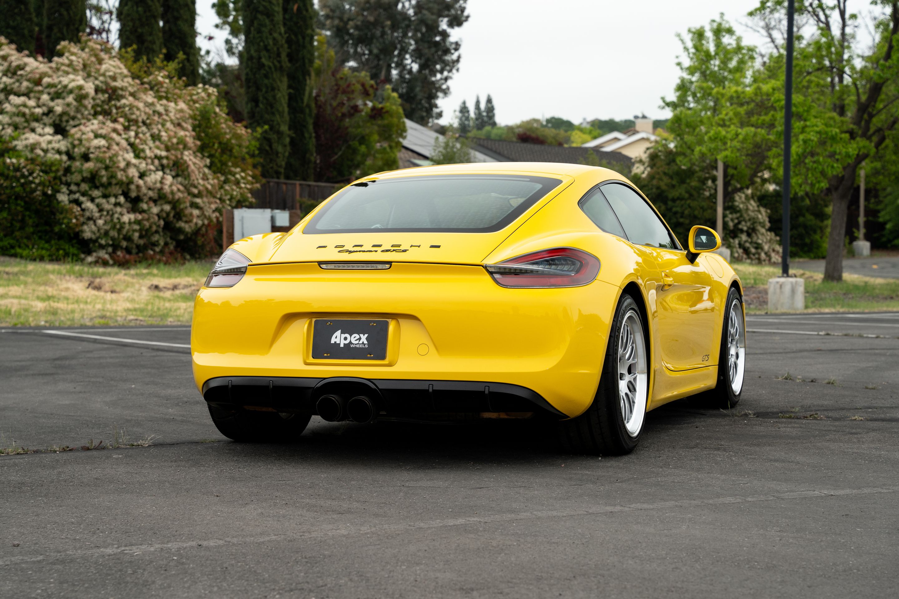 Yellow Porsche 981 Cayman GTS with 19" ML-10RT Apex wheels in Machined Lip Race Silver