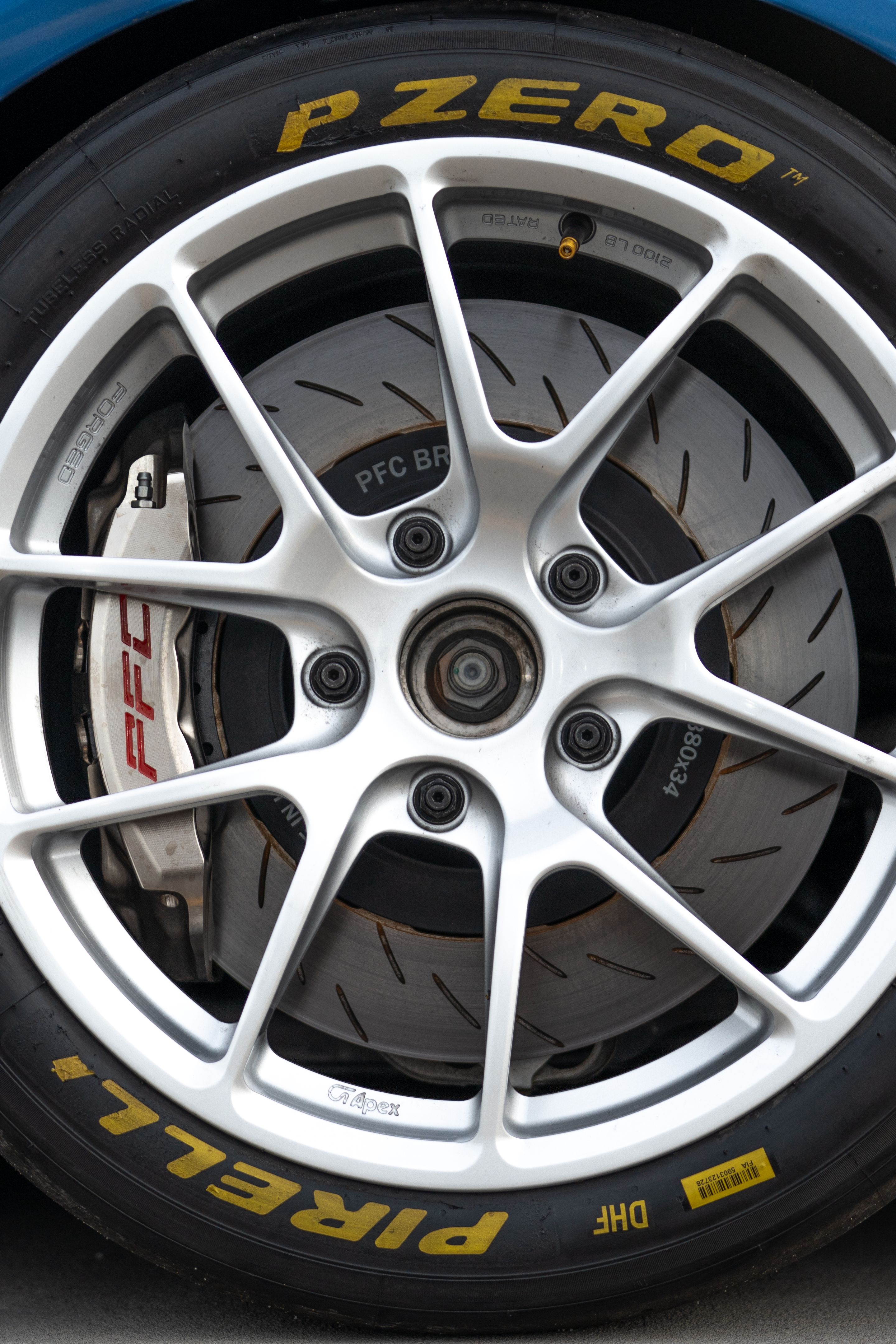 Blue Porsche 981 Cayman GT4 with 18" VS-5RE Apex wheels in Race Silver