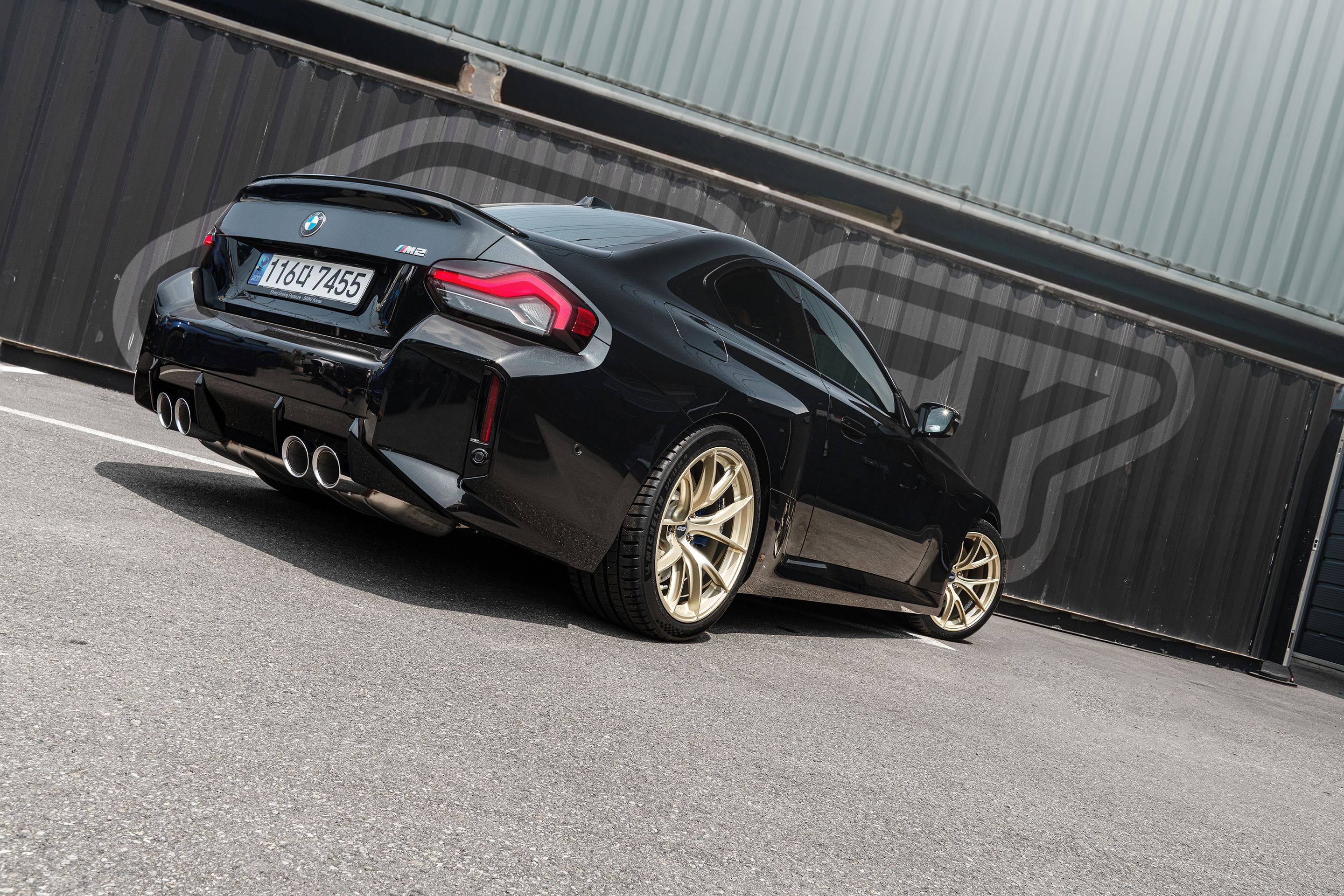 Black BMW G87 M2 with 19" VS-5RS Apex wheels in Motorsport Gold