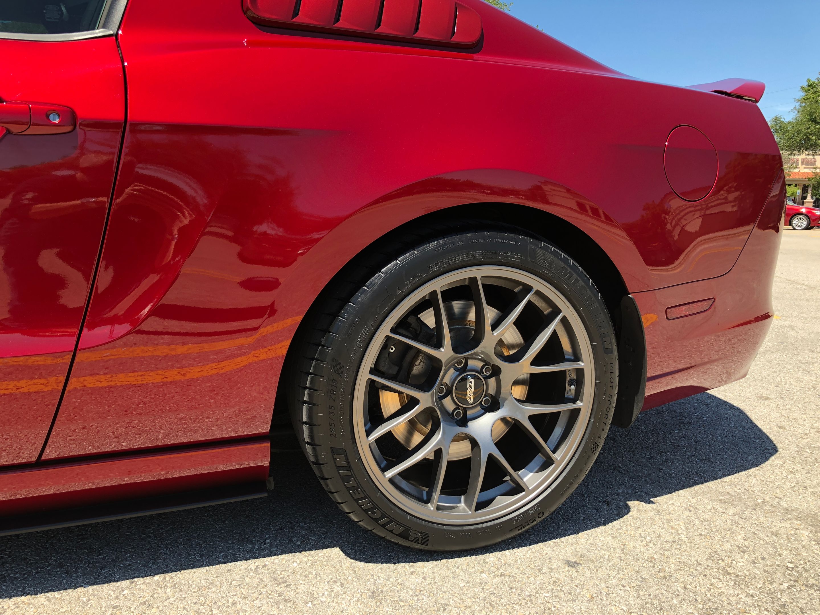 Red Ford S197 Mustang GT with 19" EC-7 Apex wheels in Anthracite