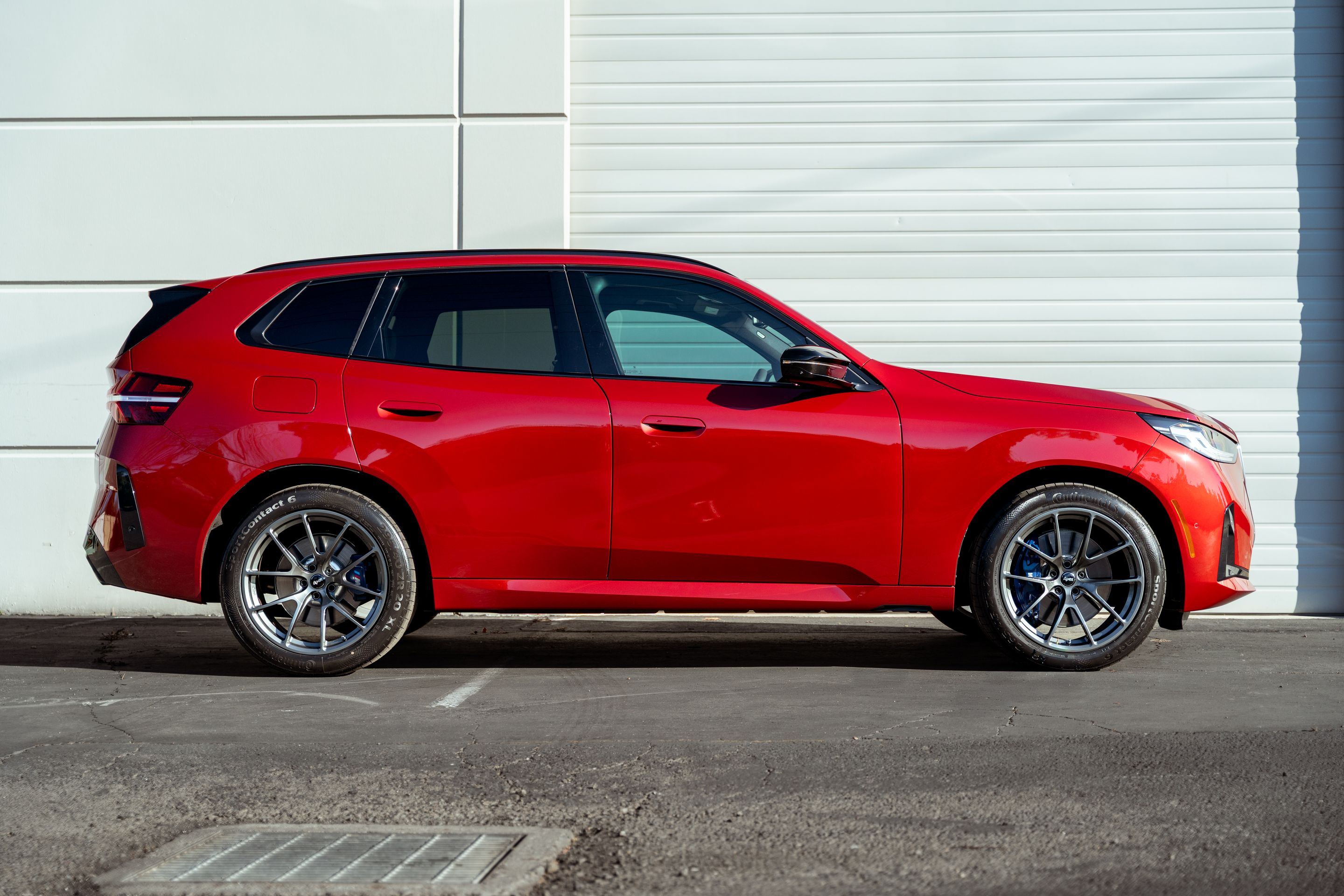 Red BMW G45 X3 with 20" VS-5RX Apex wheels in Anthracite