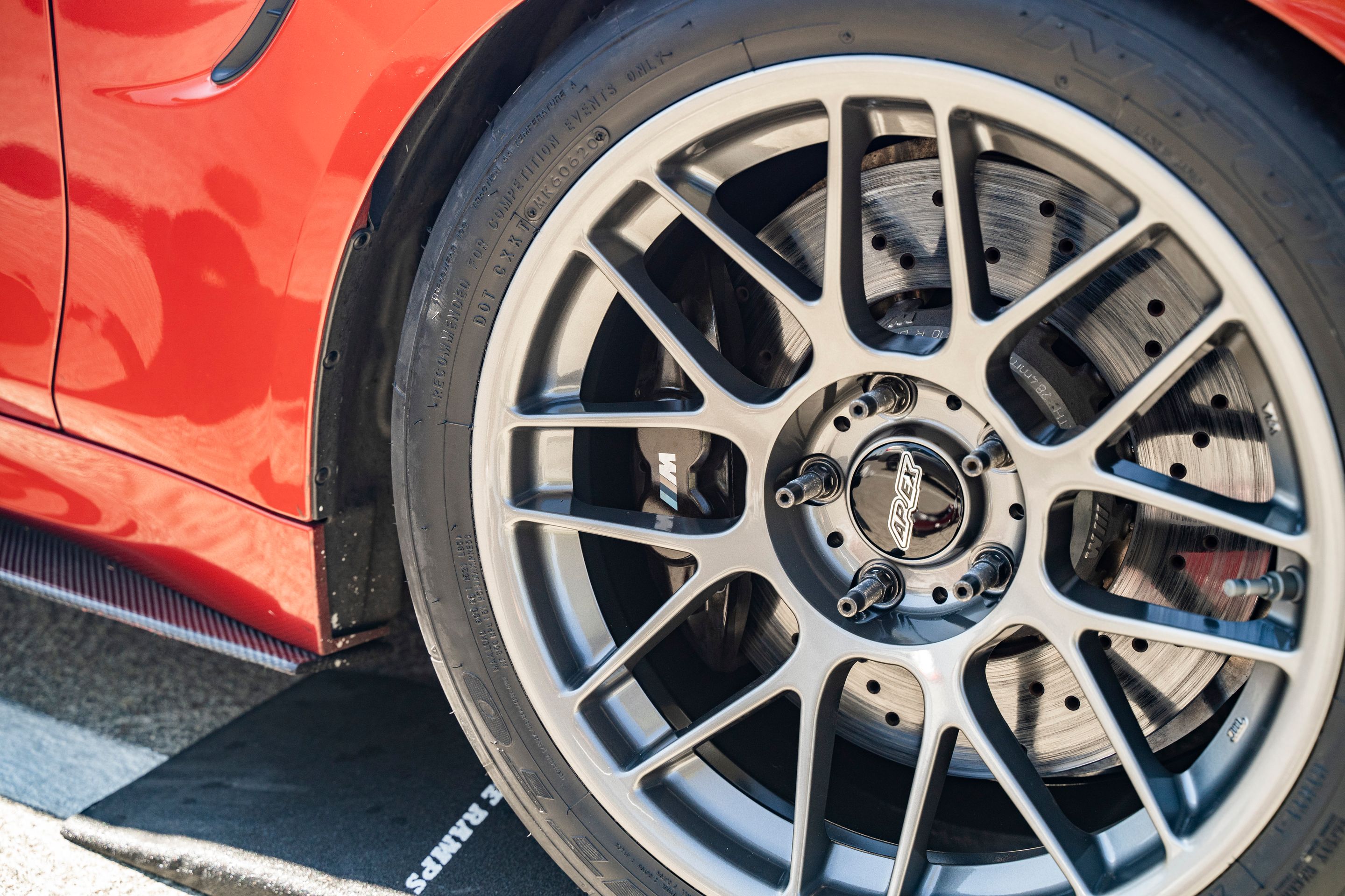 Orange BMW F82 Coupe M4 with 18" ARC-8 Apex wheels in Anthracite