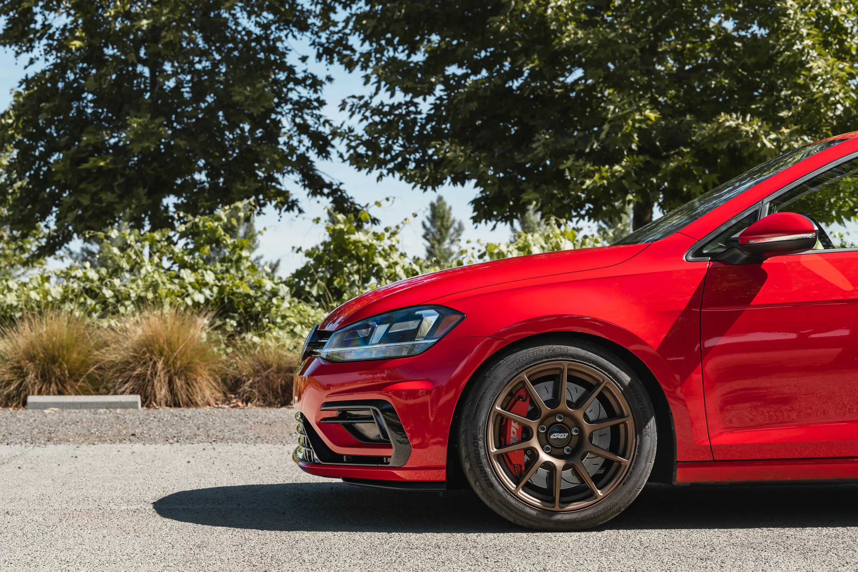 Red VW MK7 Alltrack/SportWagen Golf SportWagen with 17" SM-10 Apex wheels in Satin Bronze
