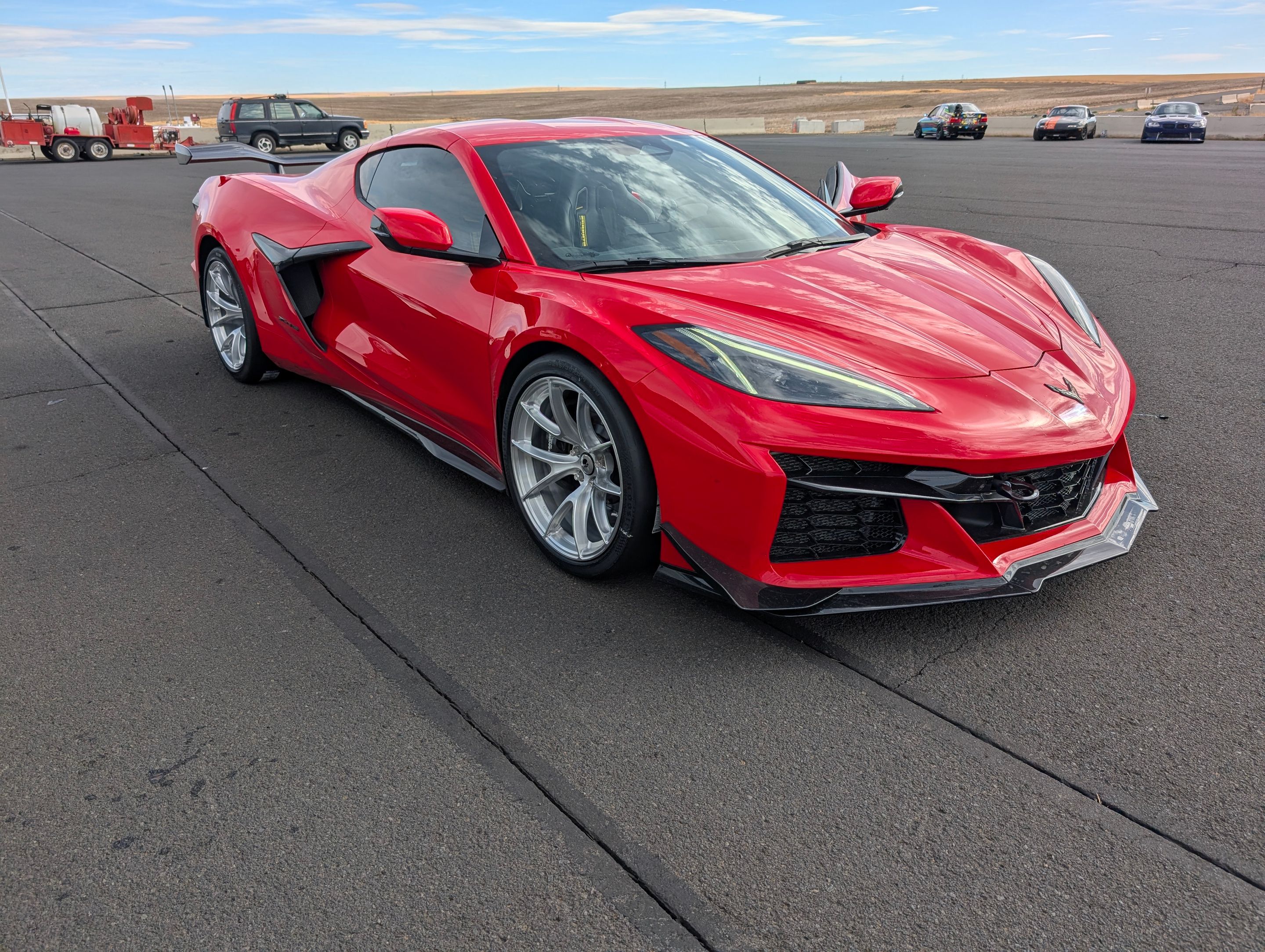 Red Chevrolet C8 Corvette Z06 with 19" VS-5RS Apex wheels in Brushed Clear