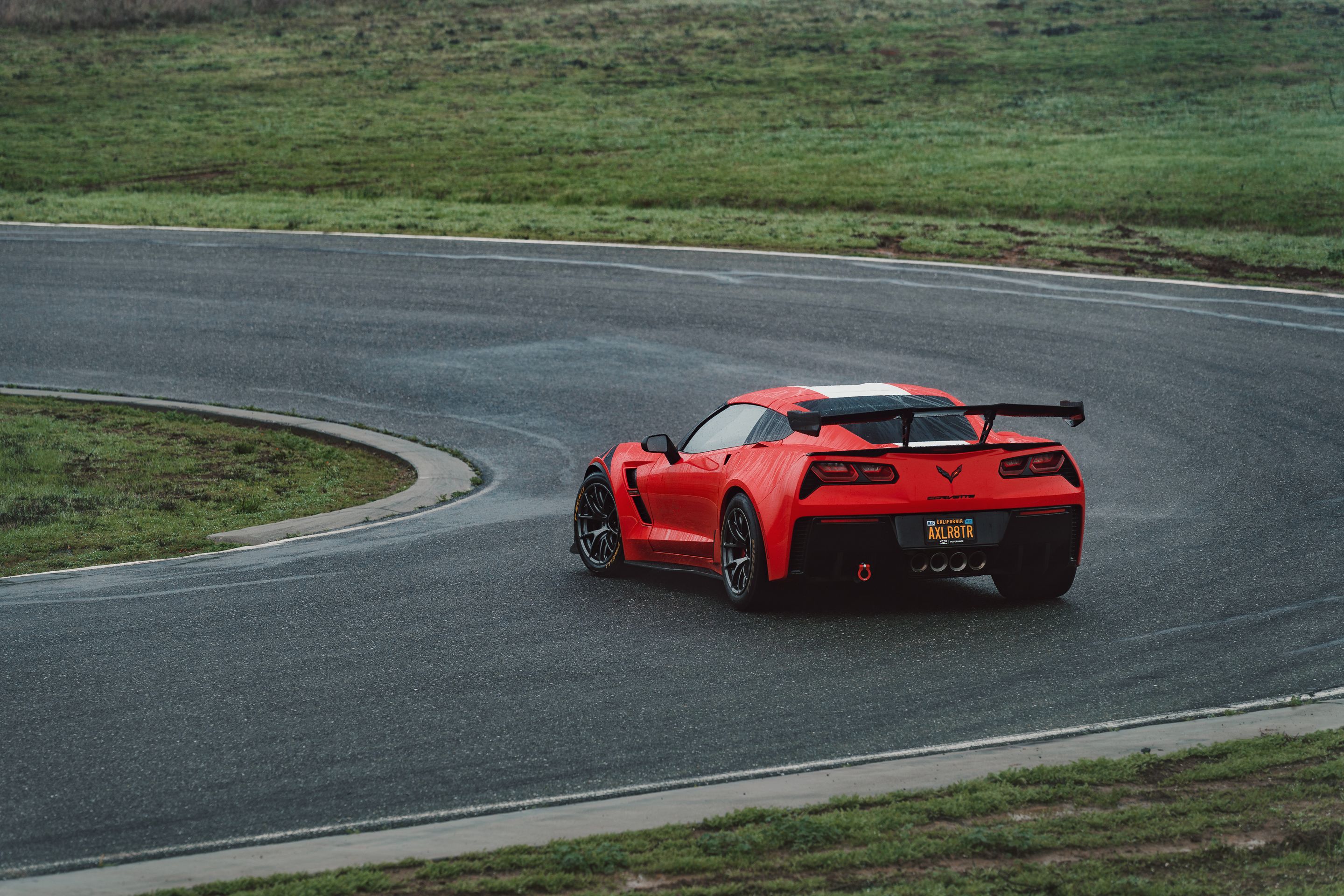 Red Chevrolet C7 Corvette Grand Sport with 18" VS-5RE Apex wheels in Anthracite
