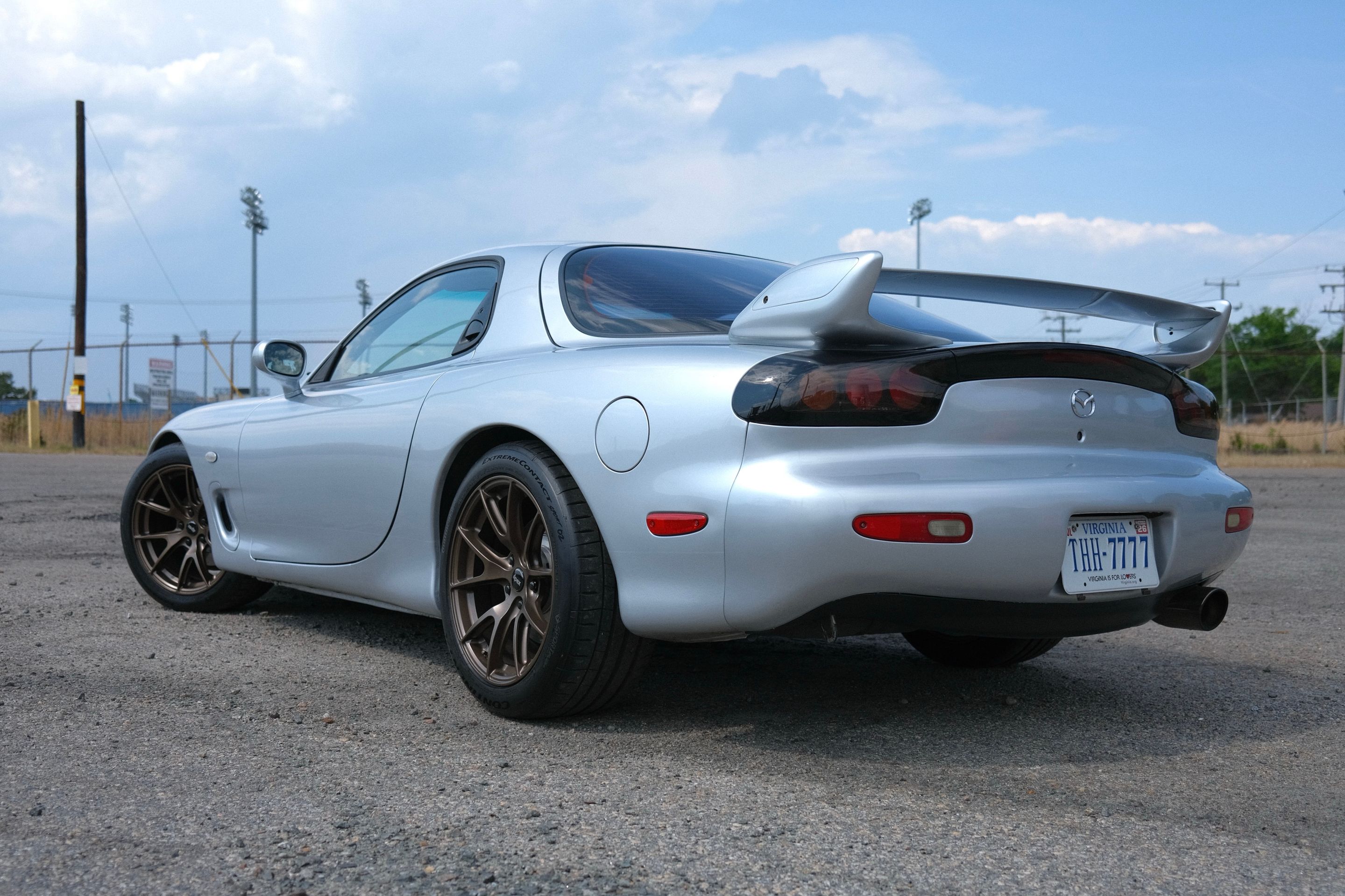 Silver Mazda FD RX-7 with 17" VS-5 Apex wheels in Satin Bronze