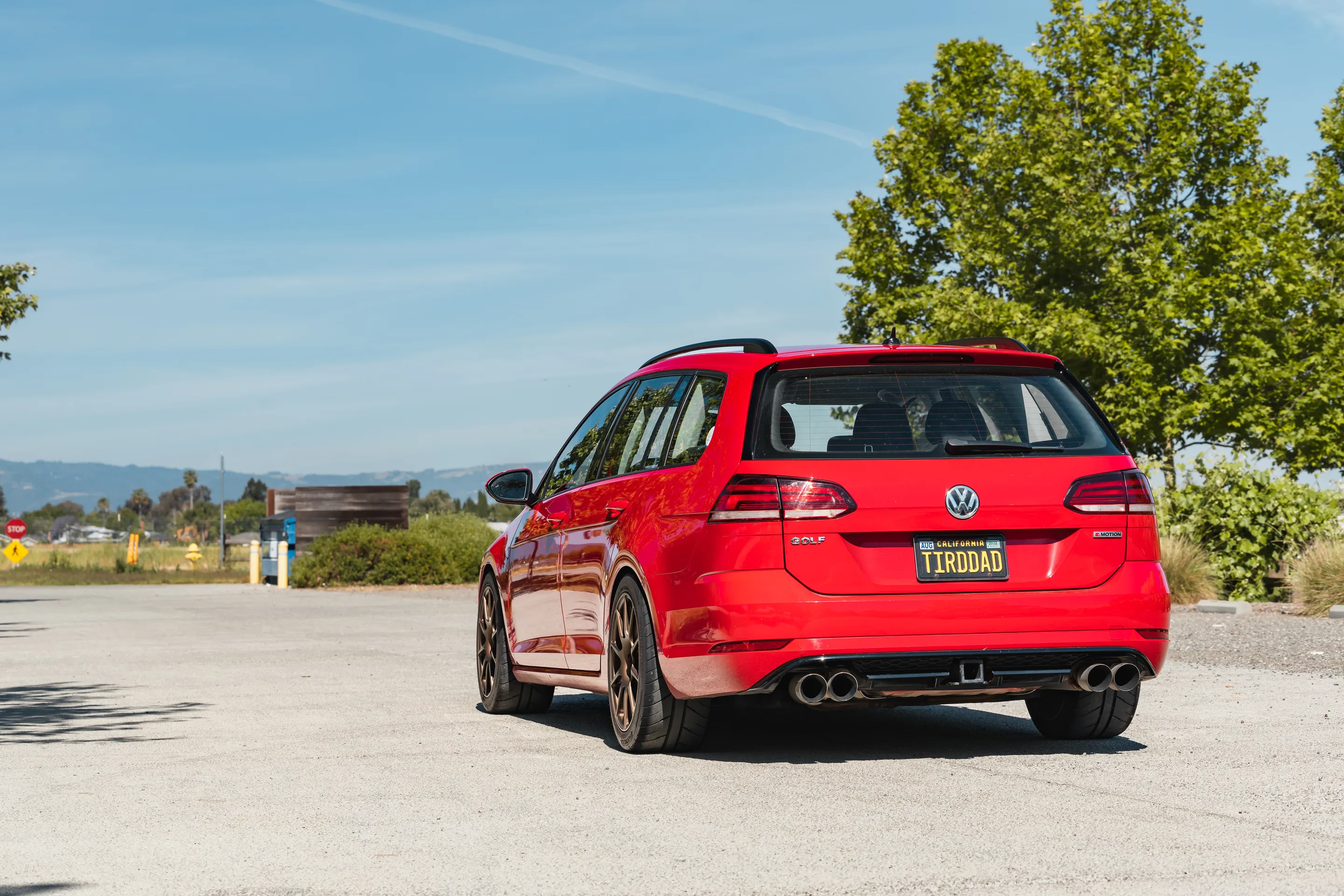 Red VW MK7 Alltrack/SportWagen Golf SportWagen with 17" SM-10 Apex wheels in Satin Bronze