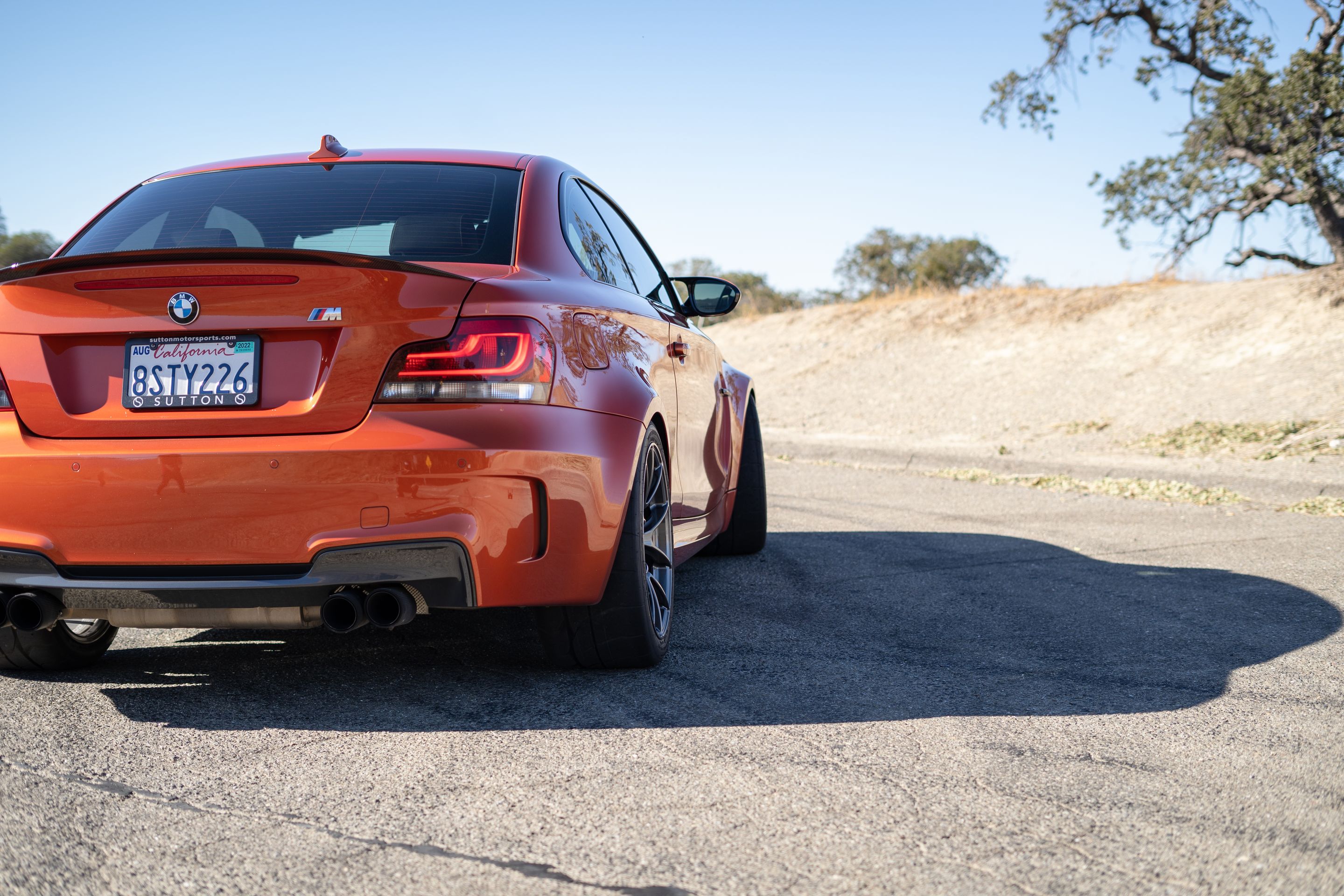 Orange BMW E82 1M with 18" VS-5RS Apex wheels in Anthracite