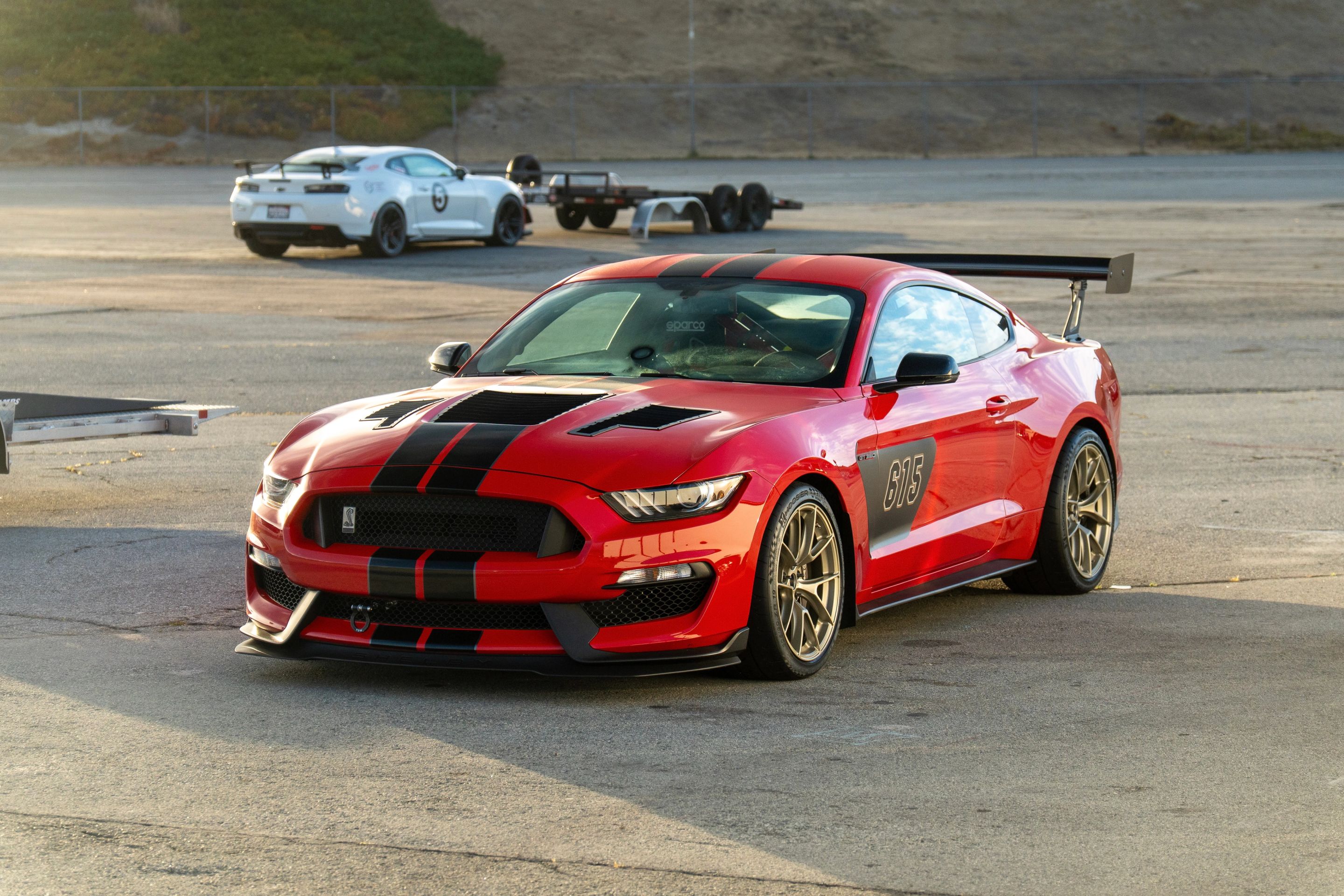 Red Ford S550 Mustang GT350 with 19" VS-5RS Apex wheels in Motorsport Gold
