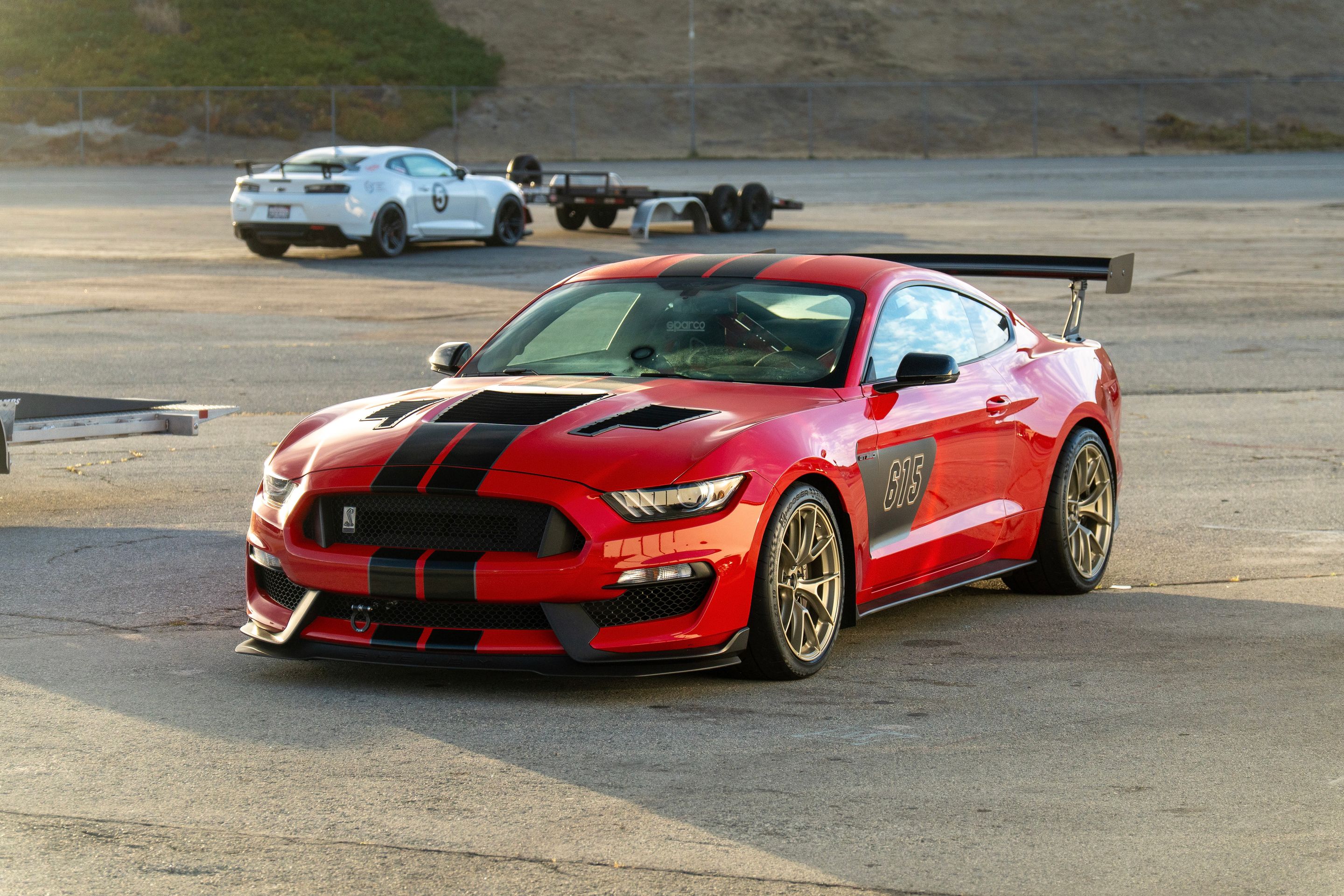 Red Ford S550 Mustang GT350 with 19" VS-5RS Apex wheels in Motorsport Gold