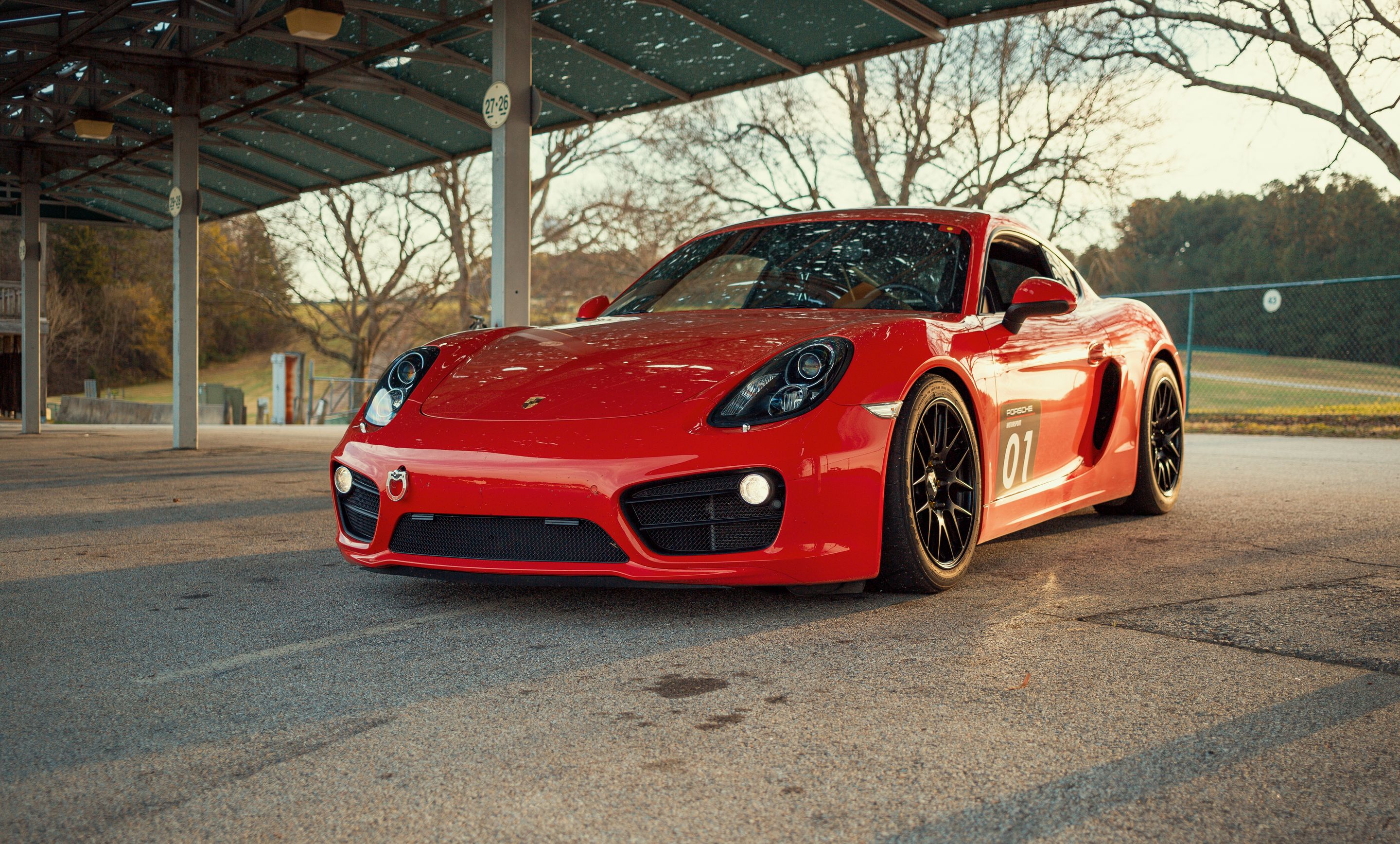 Red Porsche 981 Cayman S with 18" EC-7R Apex wheels in Satin Black