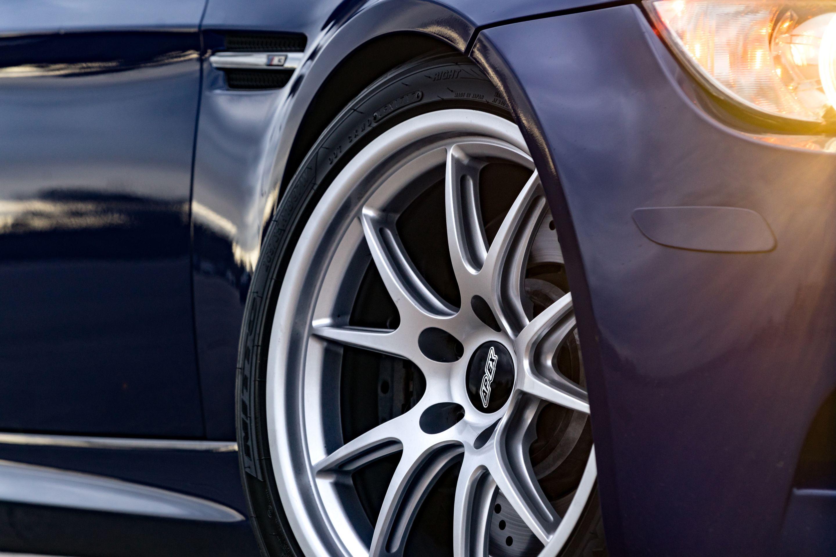 Blue BMW E90 Sedan M3 with 18" FL-5 Apex wheels in Race Silver