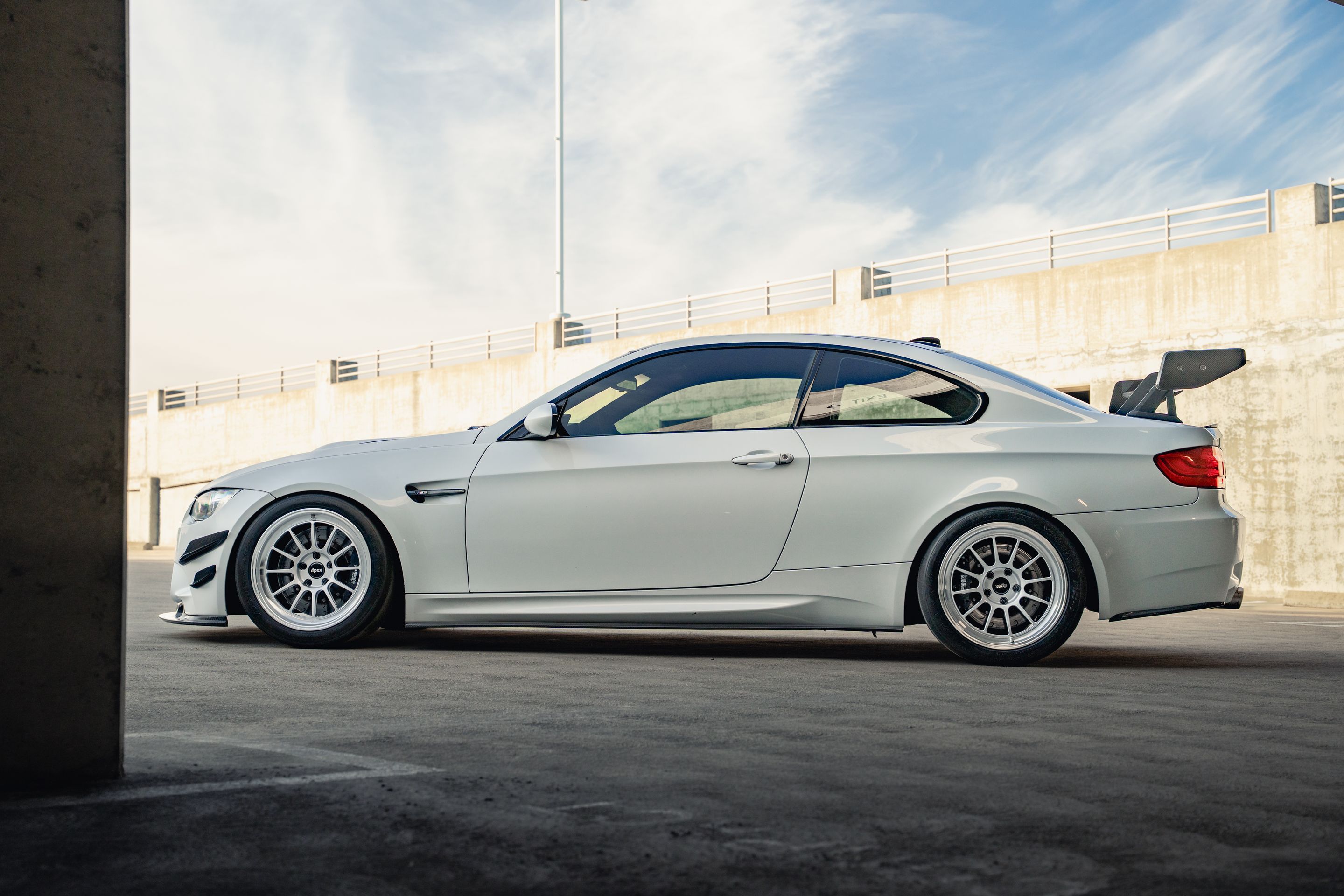 White BMW E92 Coupe M3 with 18" SL-12 Apex wheels in Machined Lip Race Silver