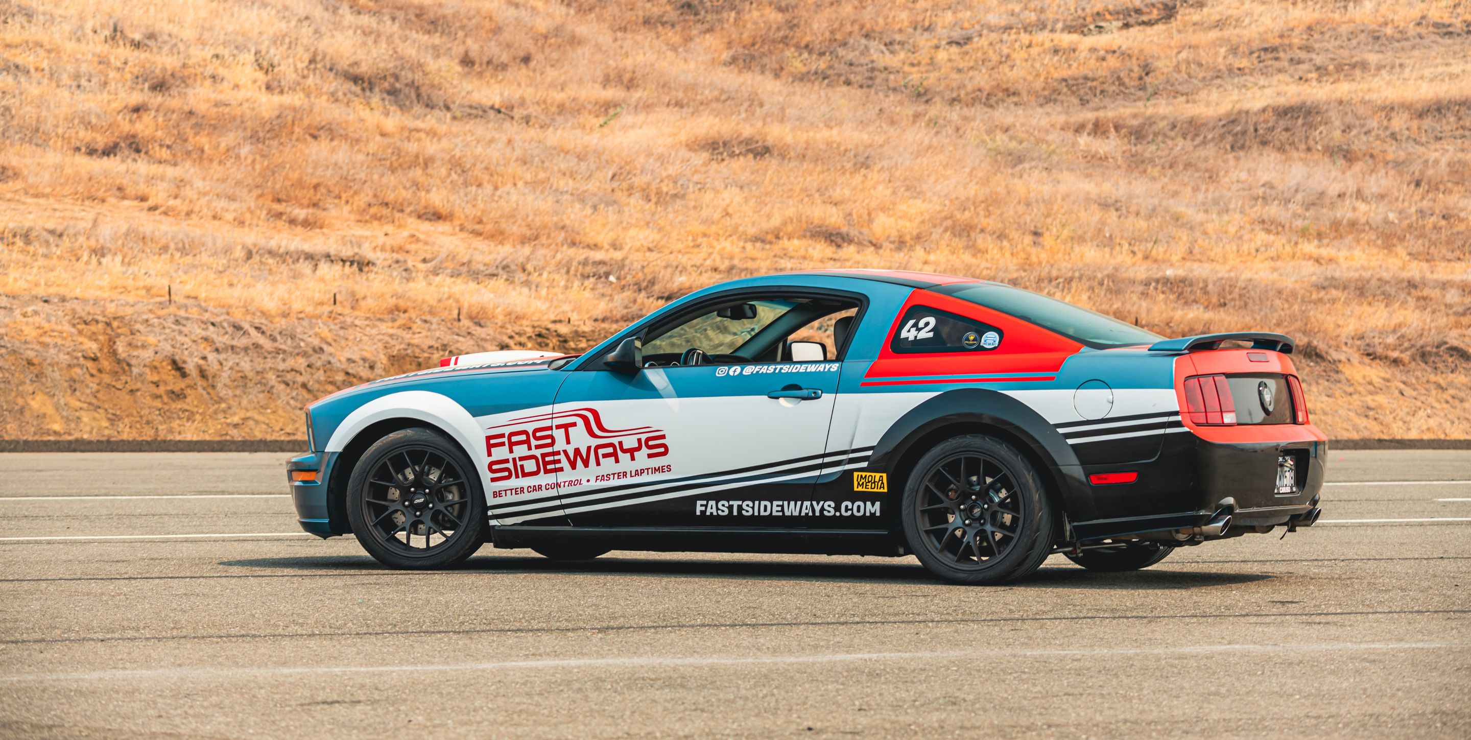 Multicolor Ford S197 Mustang GT with 18" EC-7 Apex wheels in Satin Black