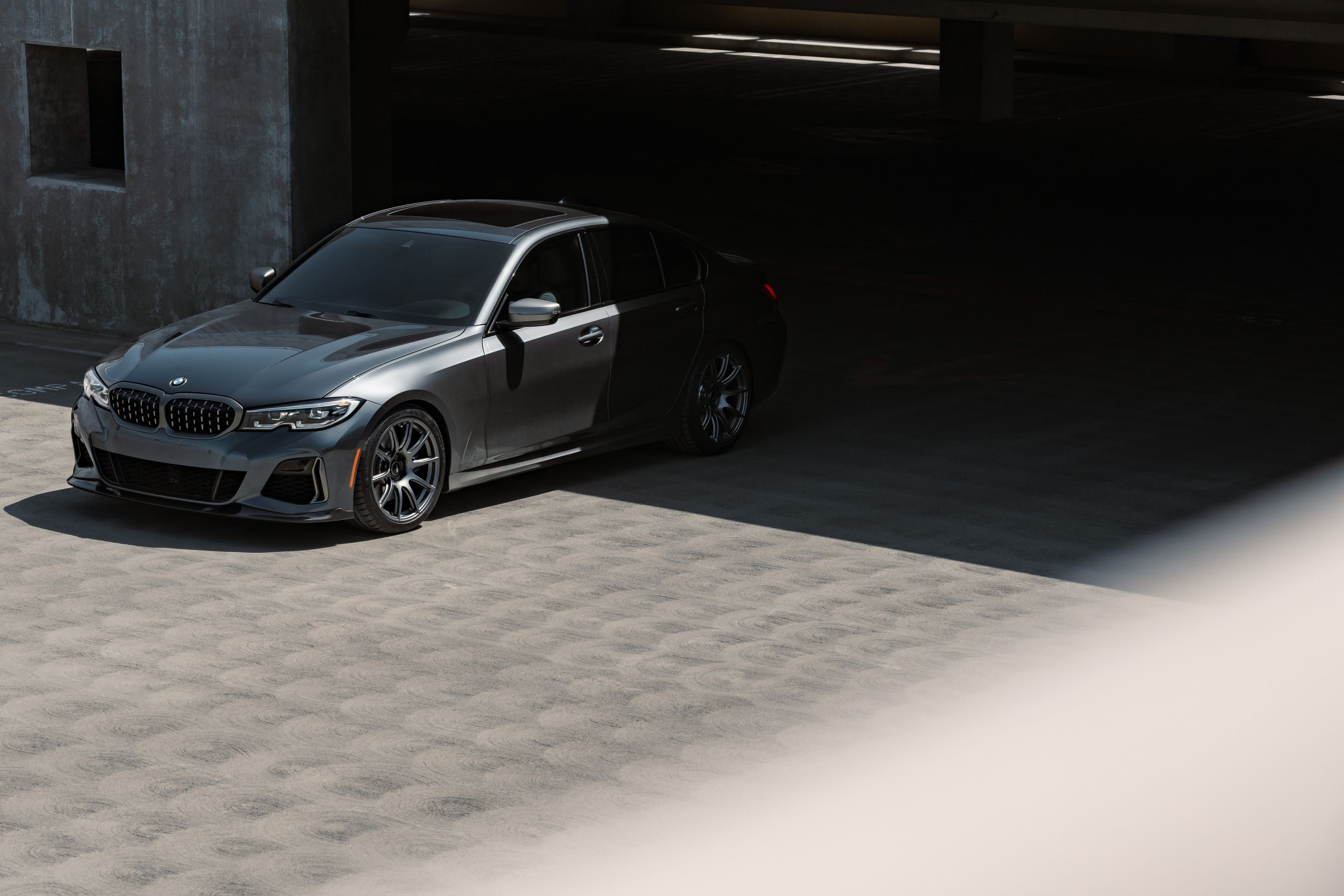 Grey BMW G20 Sedan 3 Series with 19" SM-10 Apex wheels in Anthracite