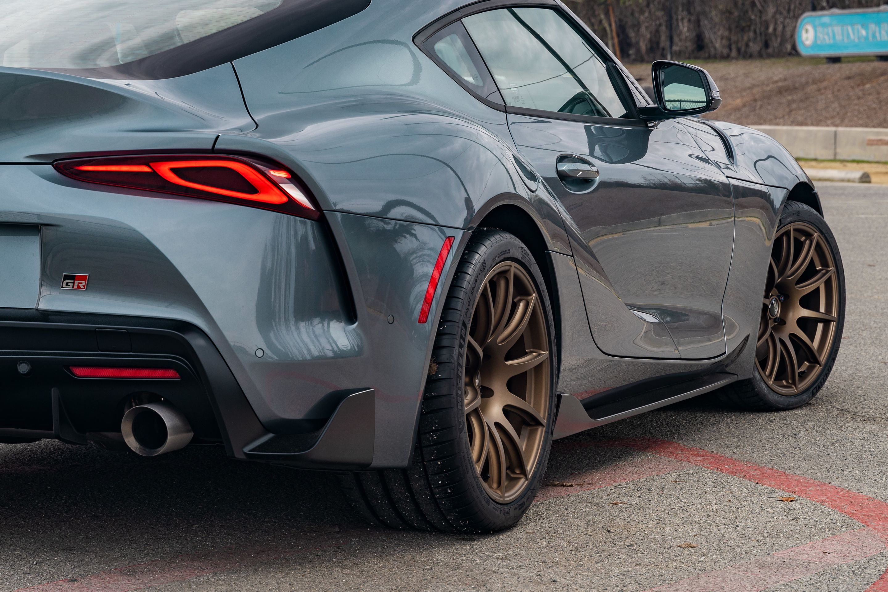 Grey Toyota GR Supra with 19" SM-10 Apex wheels in Satin Bronze