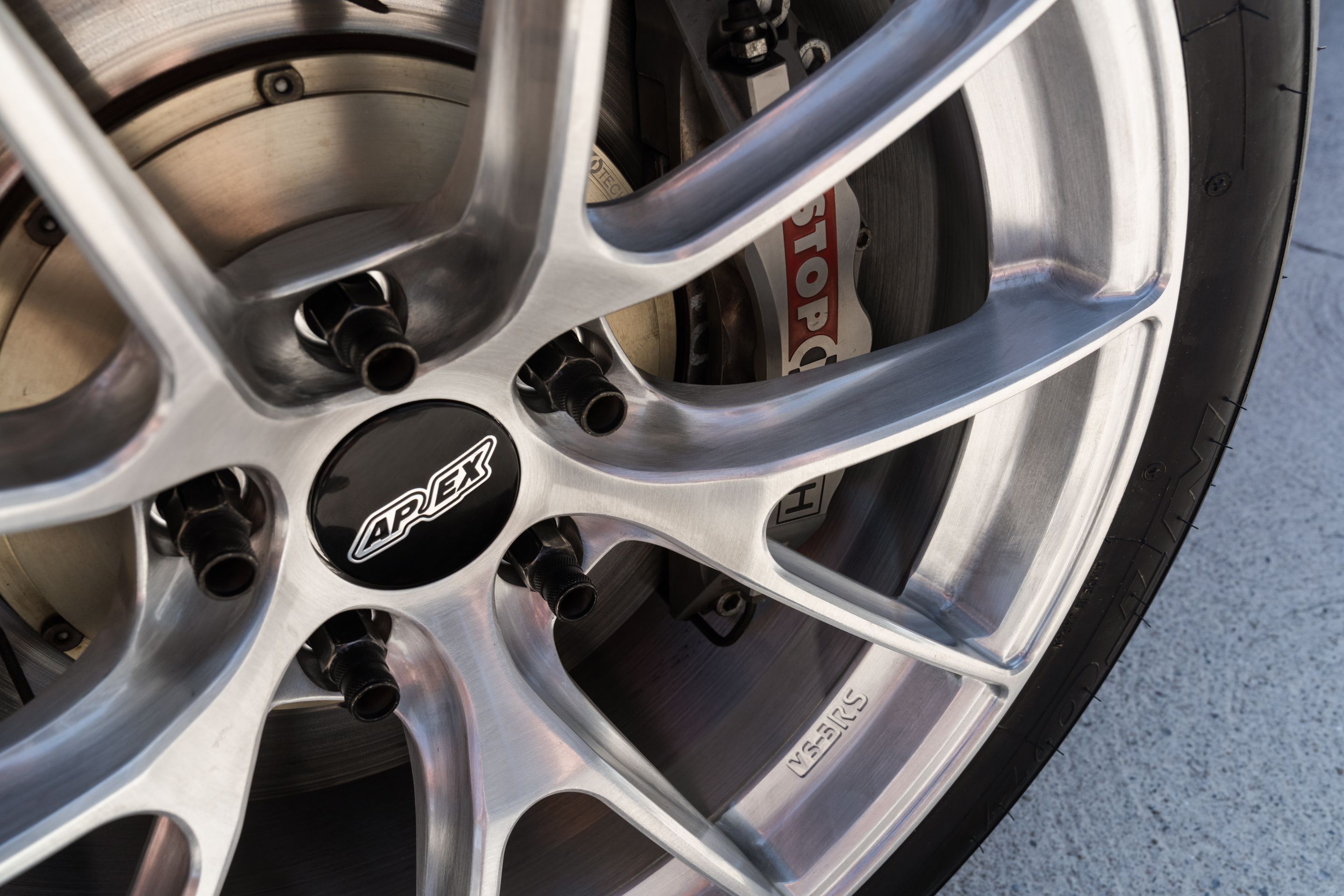 Red Chevrolet C6 Corvette Z06 with 18" VS-5RS Apex wheels in Brushed Clear