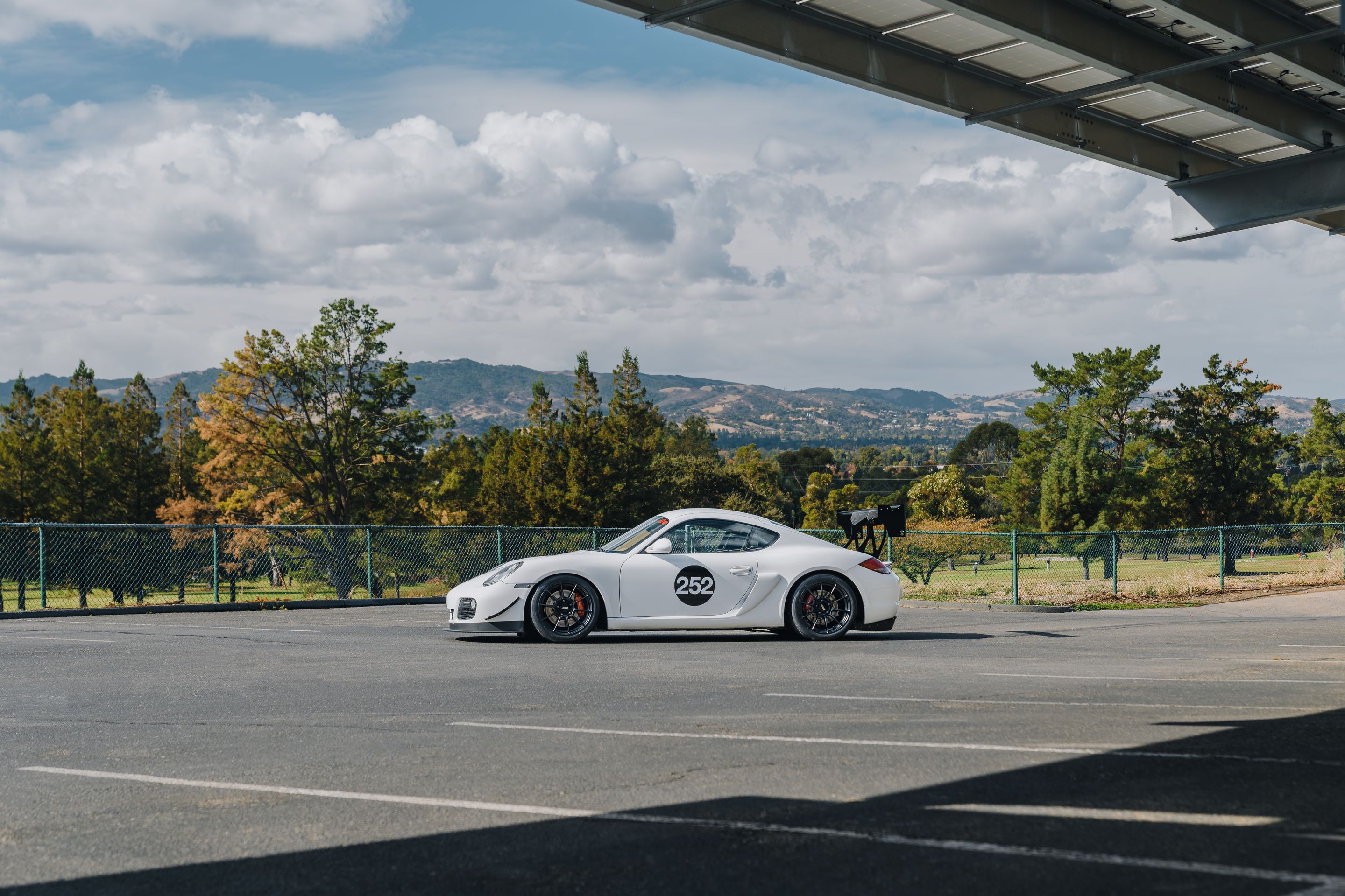 White Porsche 987 Cayman S with 18" SM-10RS Apex wheels in Satin Black