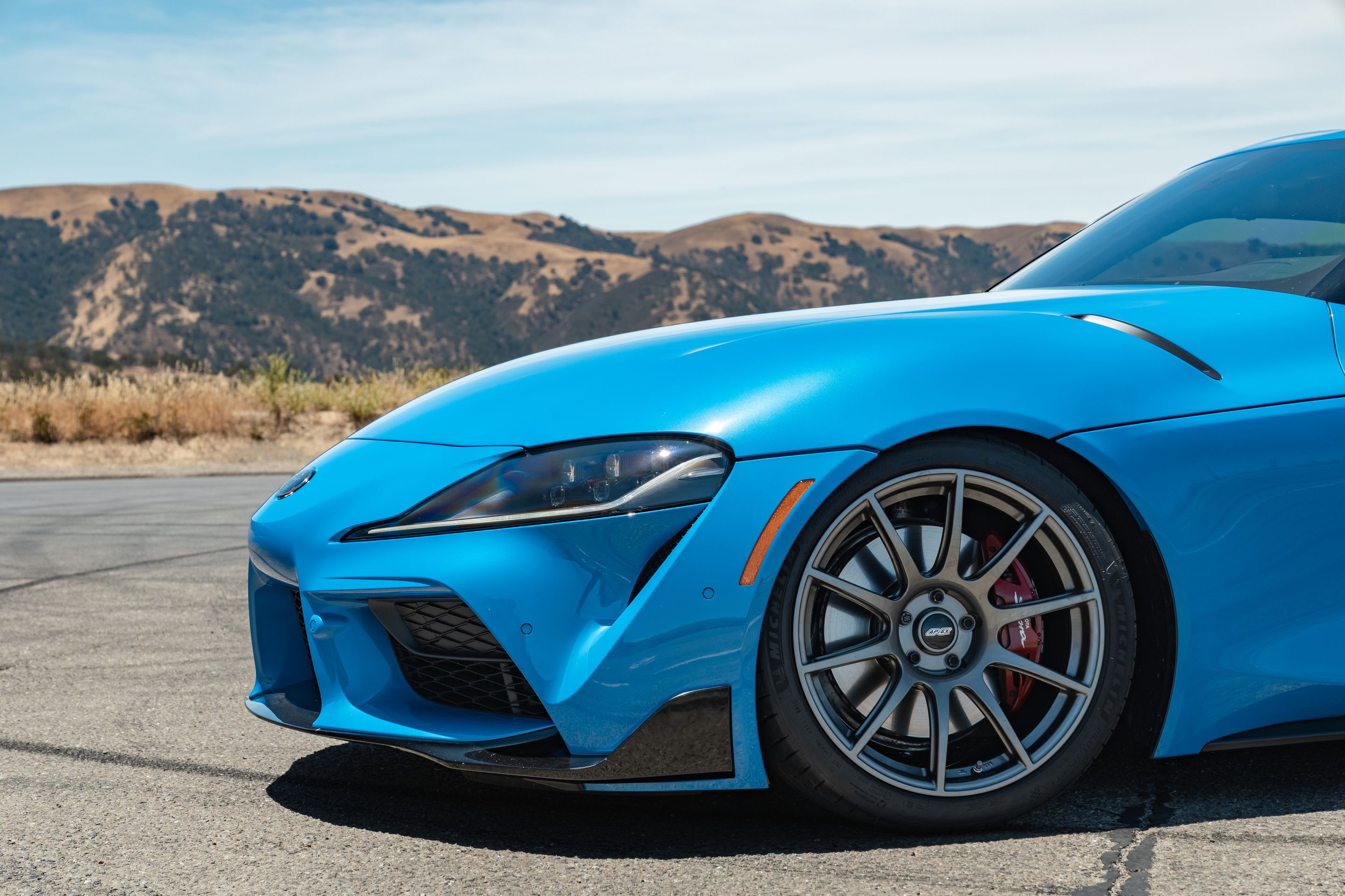 Blue Toyota GR Supra with 19" SM-10 Apex wheels in Anthracite