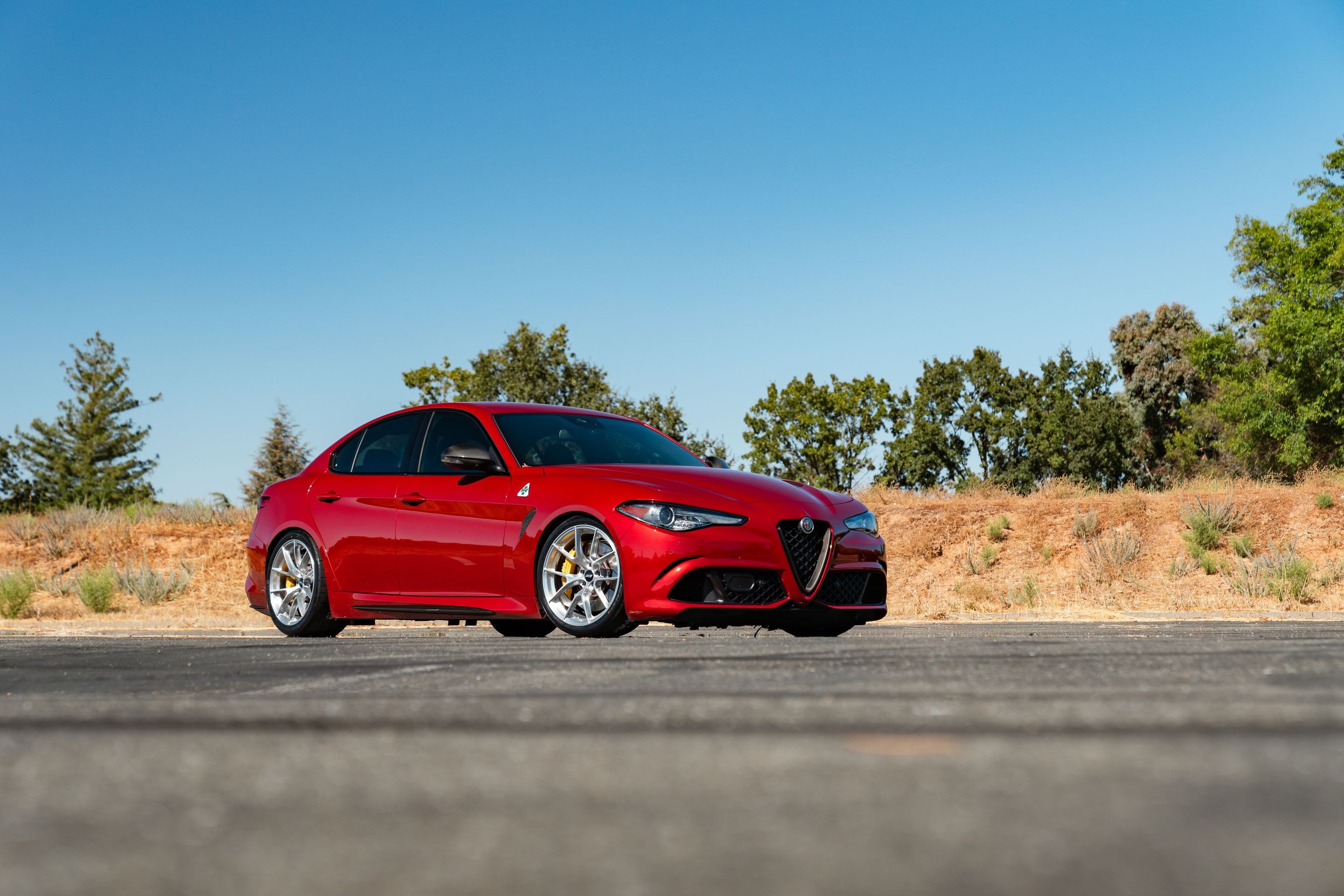 Red Alfa Romeo Giulia Quadrifoglio with 19" VS-5RS Apex wheels in Brushed Clear