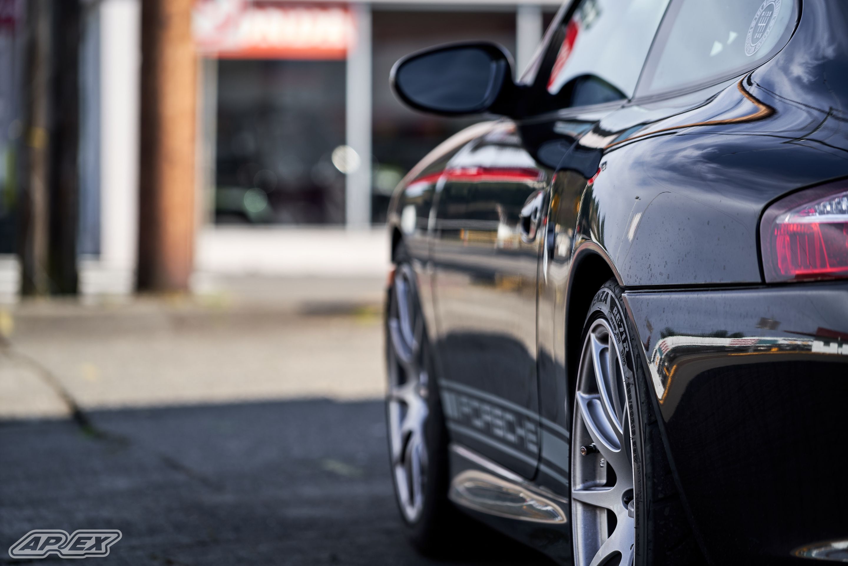 Black Porsche 911 996 Carrera with 18" SM-10 Apex wheels in Race Silver