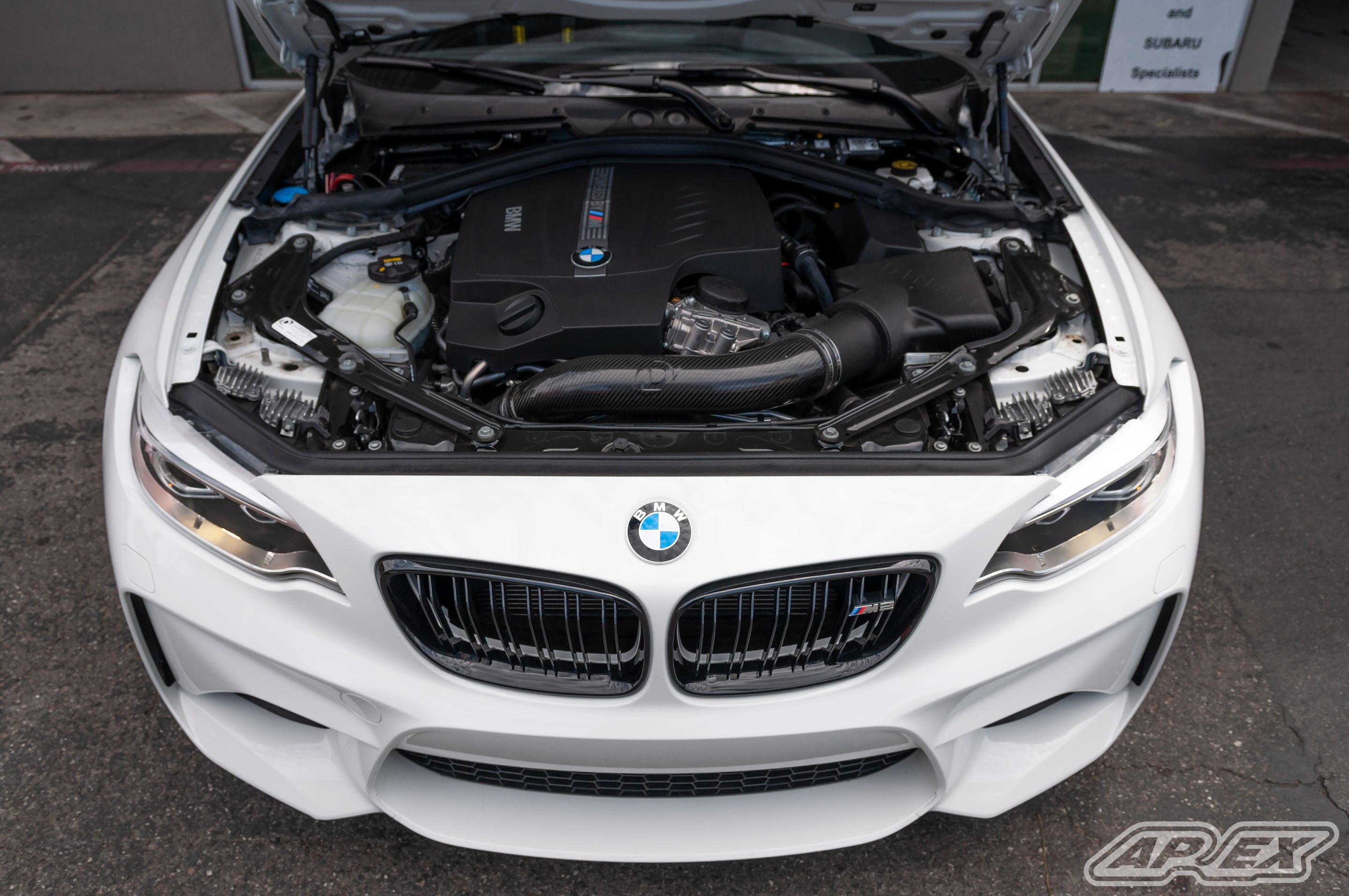 White BMW F87 M2 with 18" FL-5 Apex wheels in Satin Black
