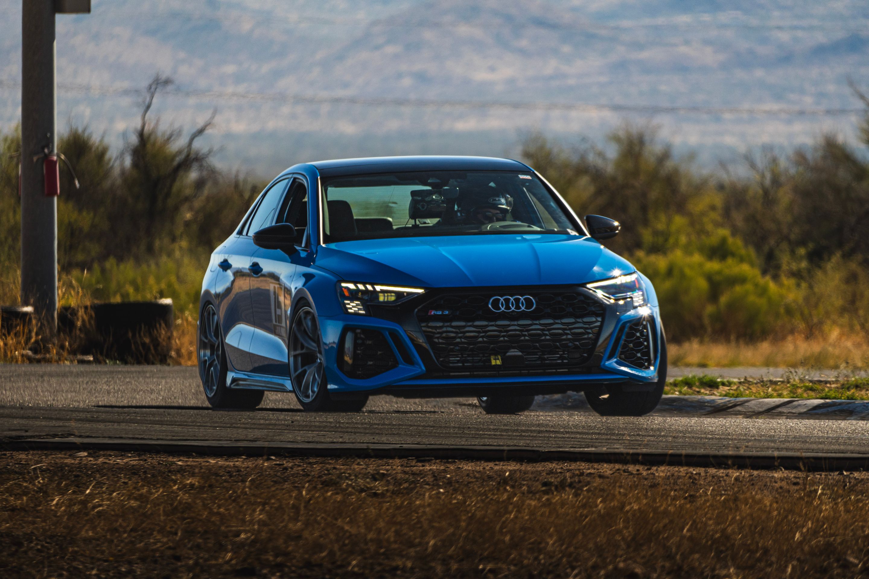 Blue Audi 8Y RS 3 with 18" VS-5RS Apex wheels in Brushed Clear