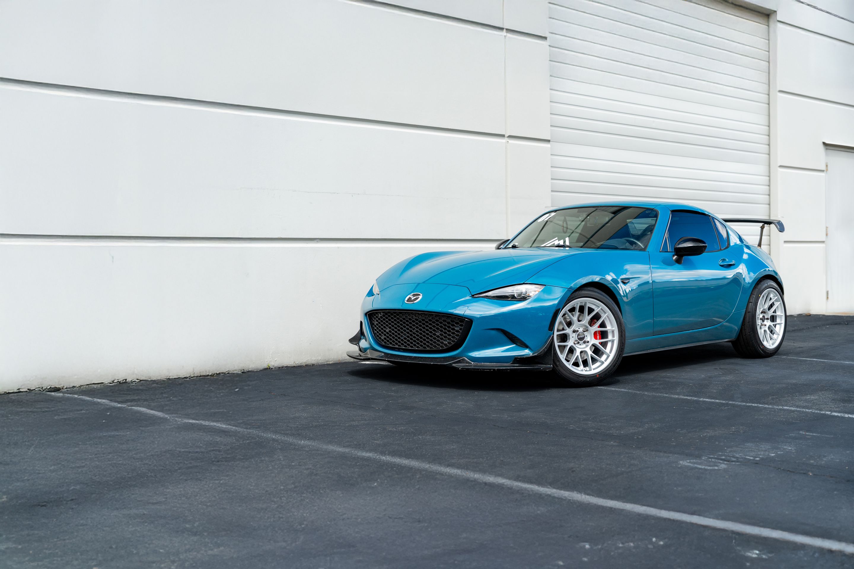 Blue Mazda ND MX-5 Miata with 17" ARC-8 Apex wheels in Race Silver