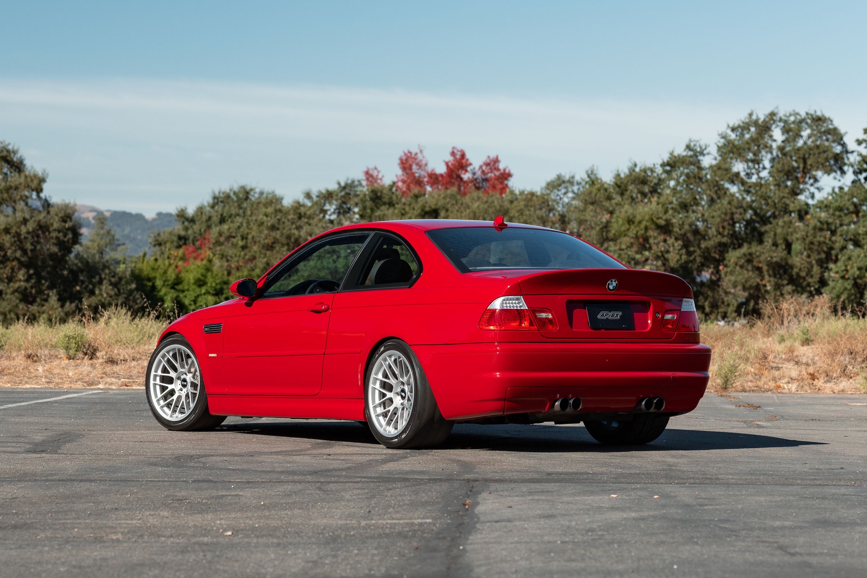 Red BMW E46 M3 with 18" ARC-8RT Apex wheels in Race Silver