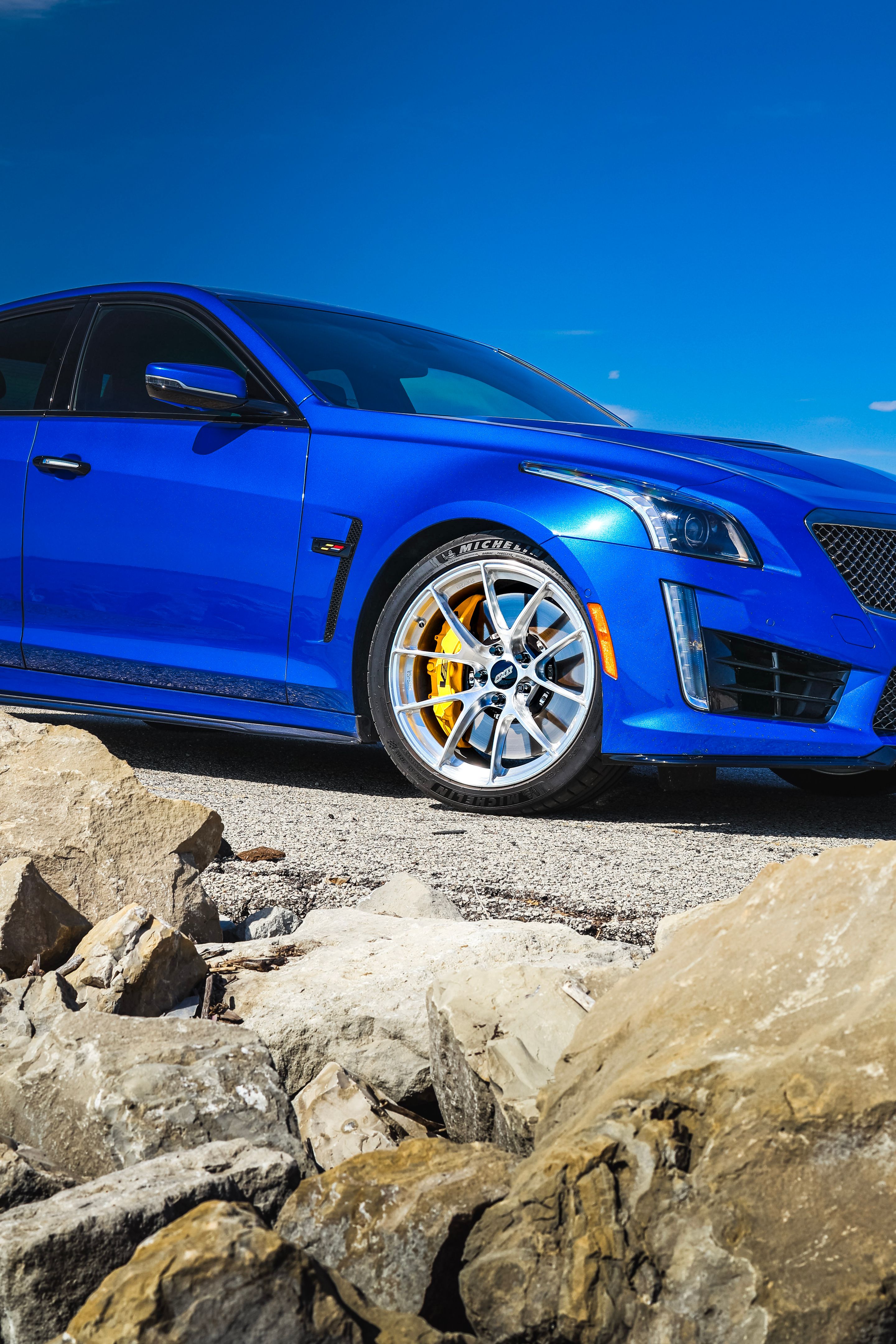 Blue Cadillac Gen 3 CTS-V with 19" VS-5RS Apex wheels in Brushed Clear