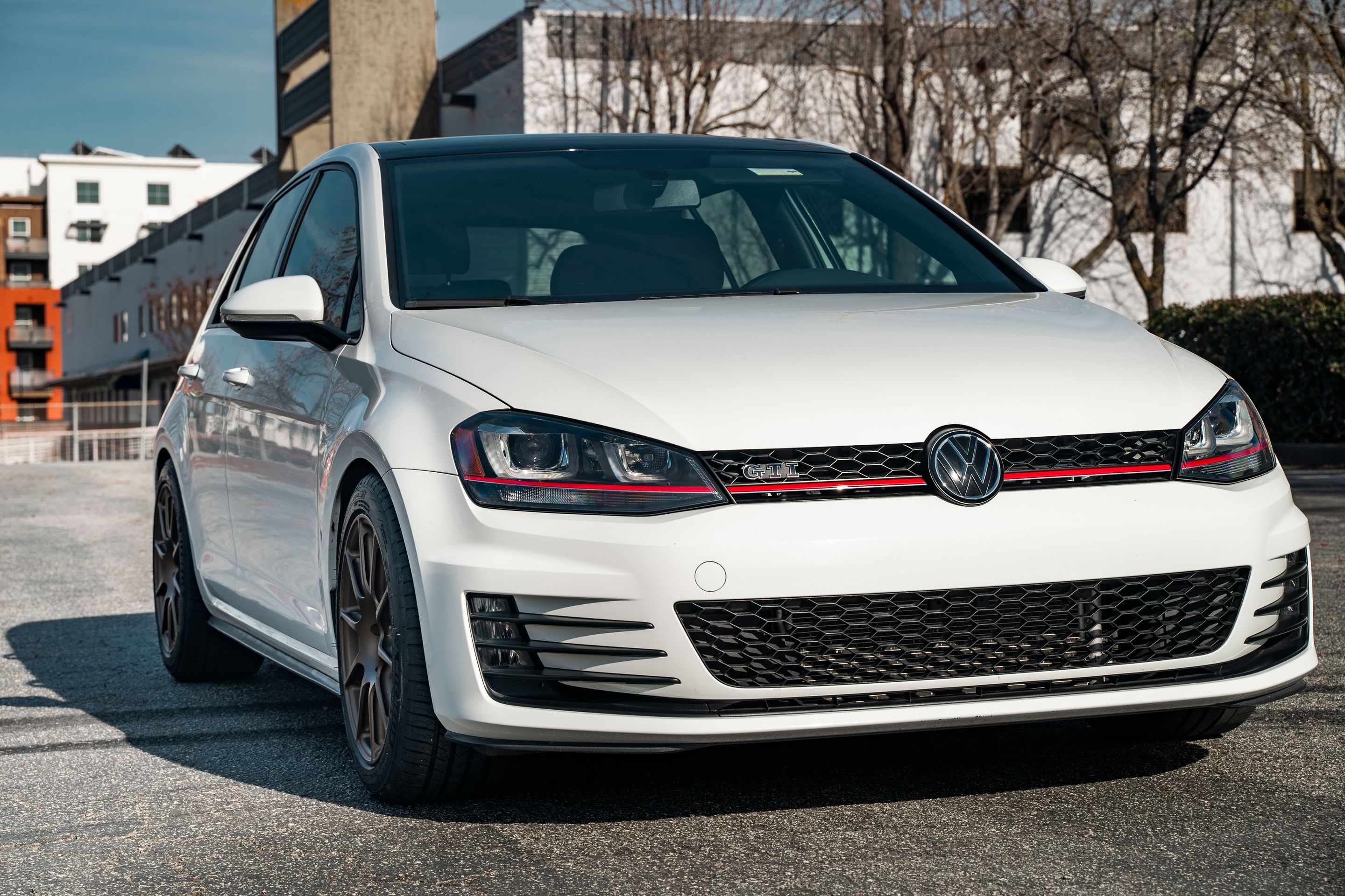White VW MK7 GTI with 17" SM-10 Apex wheels in Satin Bronze
