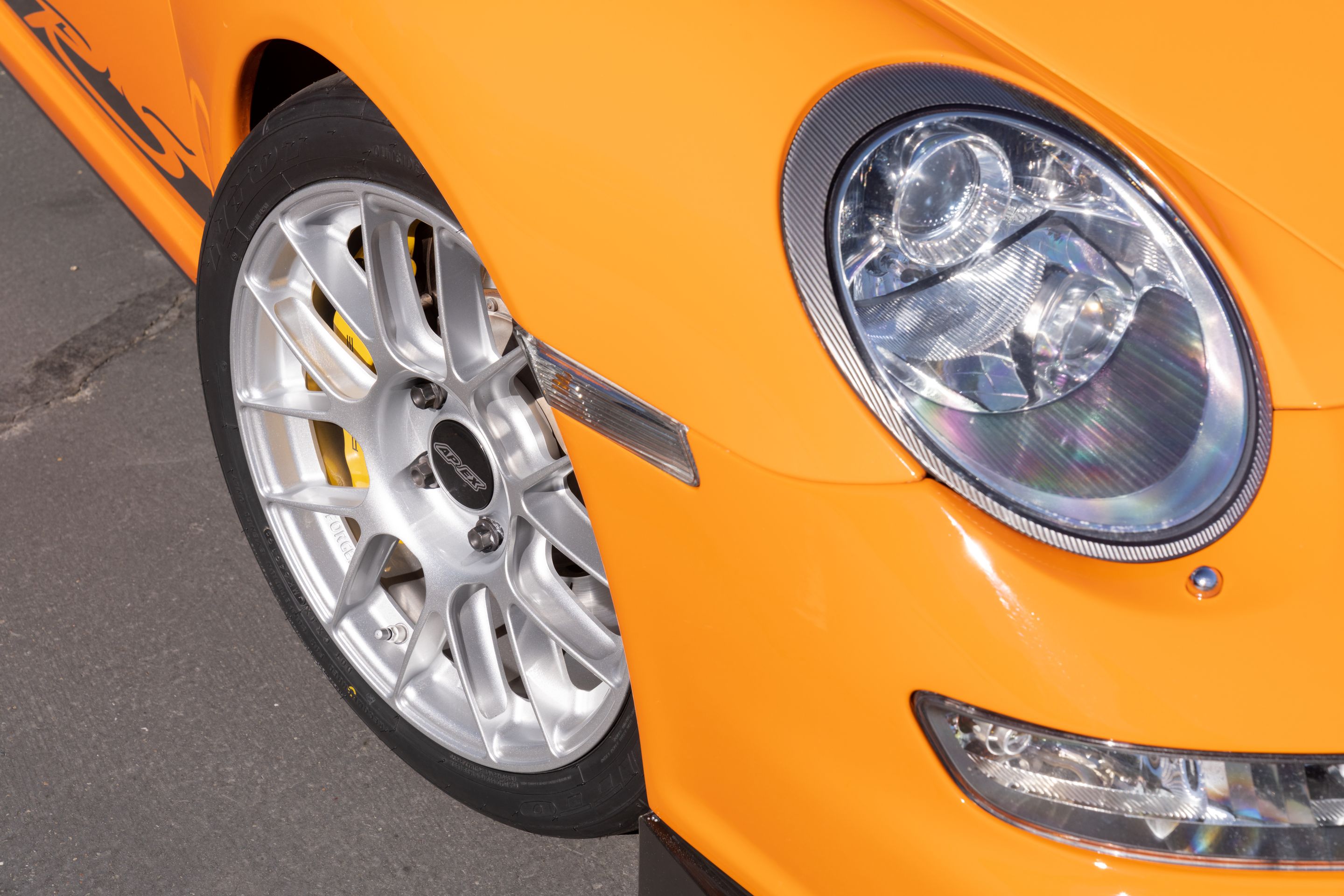 Orange Porsche 911 997 GT3 RS with 18" EC-7RS Apex wheels in Race Silver