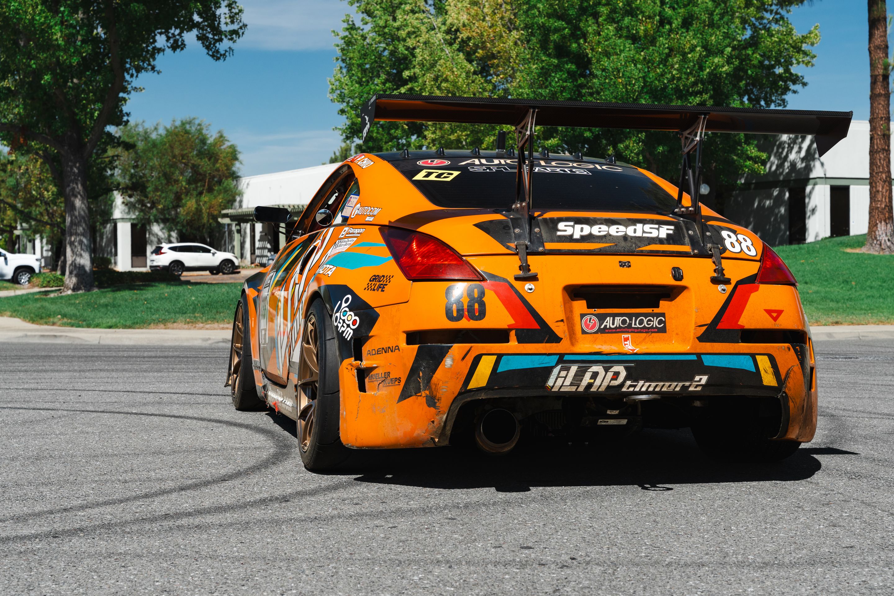 Orange Nissan 350Z with 18" VS-5RS Apex wheels in Satin Bronze