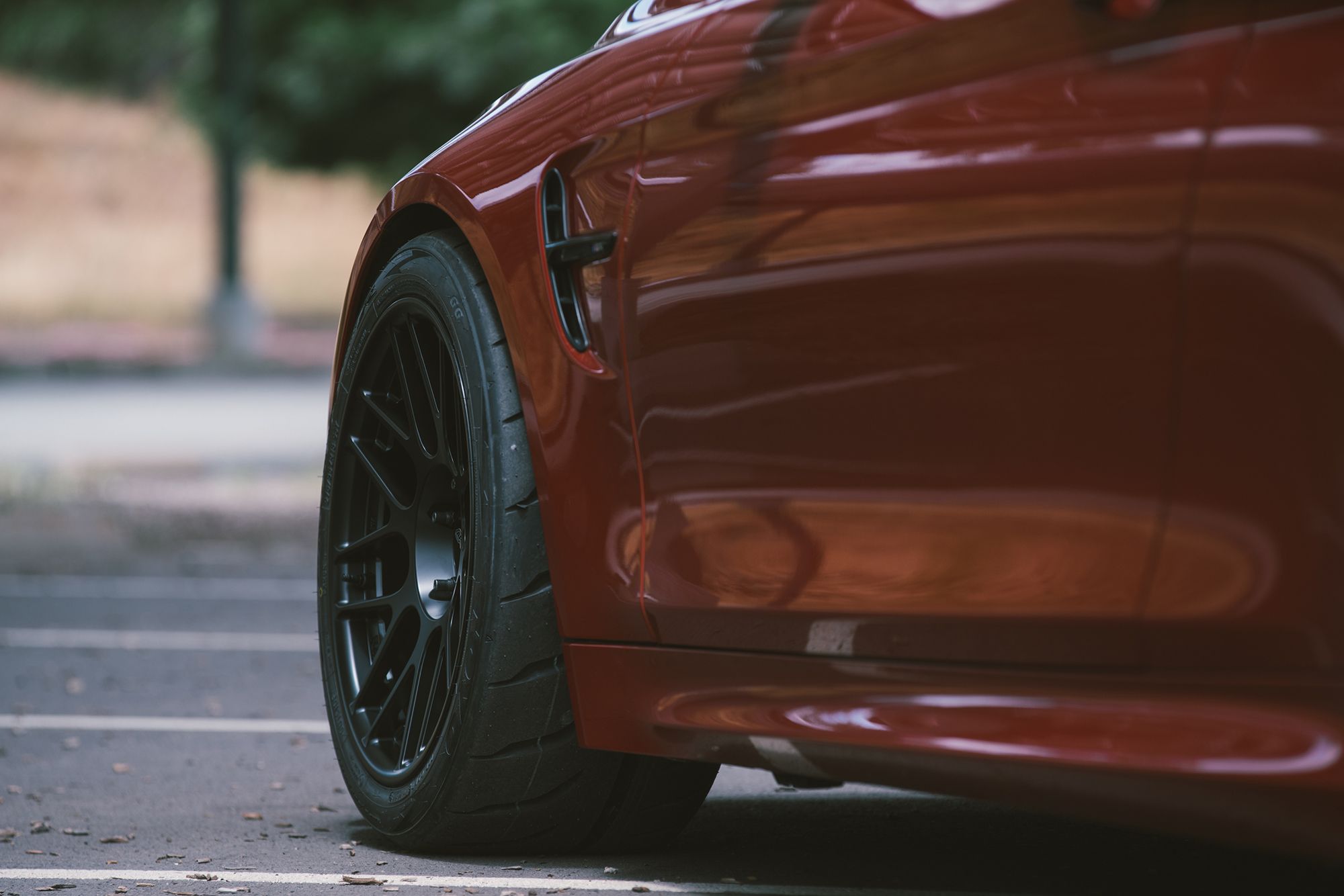 Red BMW F82 Coupe M4 with 18" ARC-8R Apex wheels in Satin Black