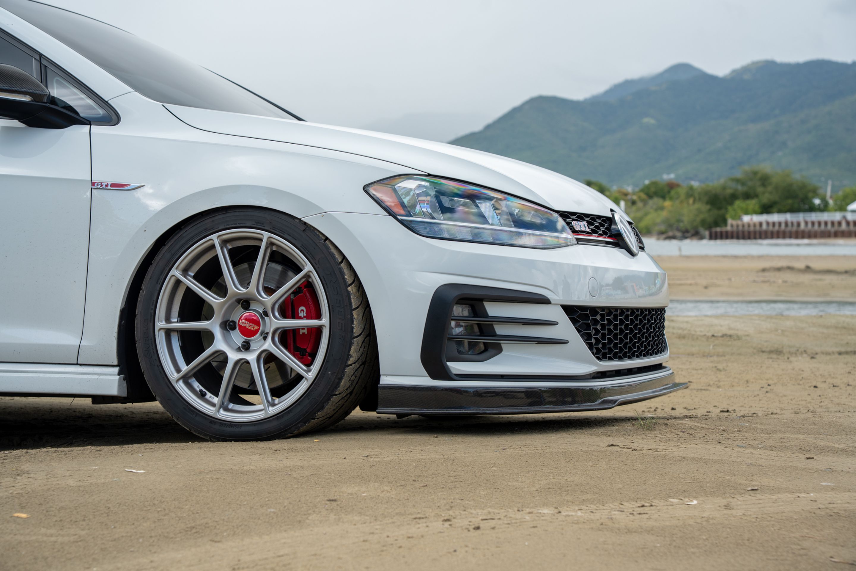 White VW MK7 GTI with 18" SM-10 Apex wheels in Race Silver