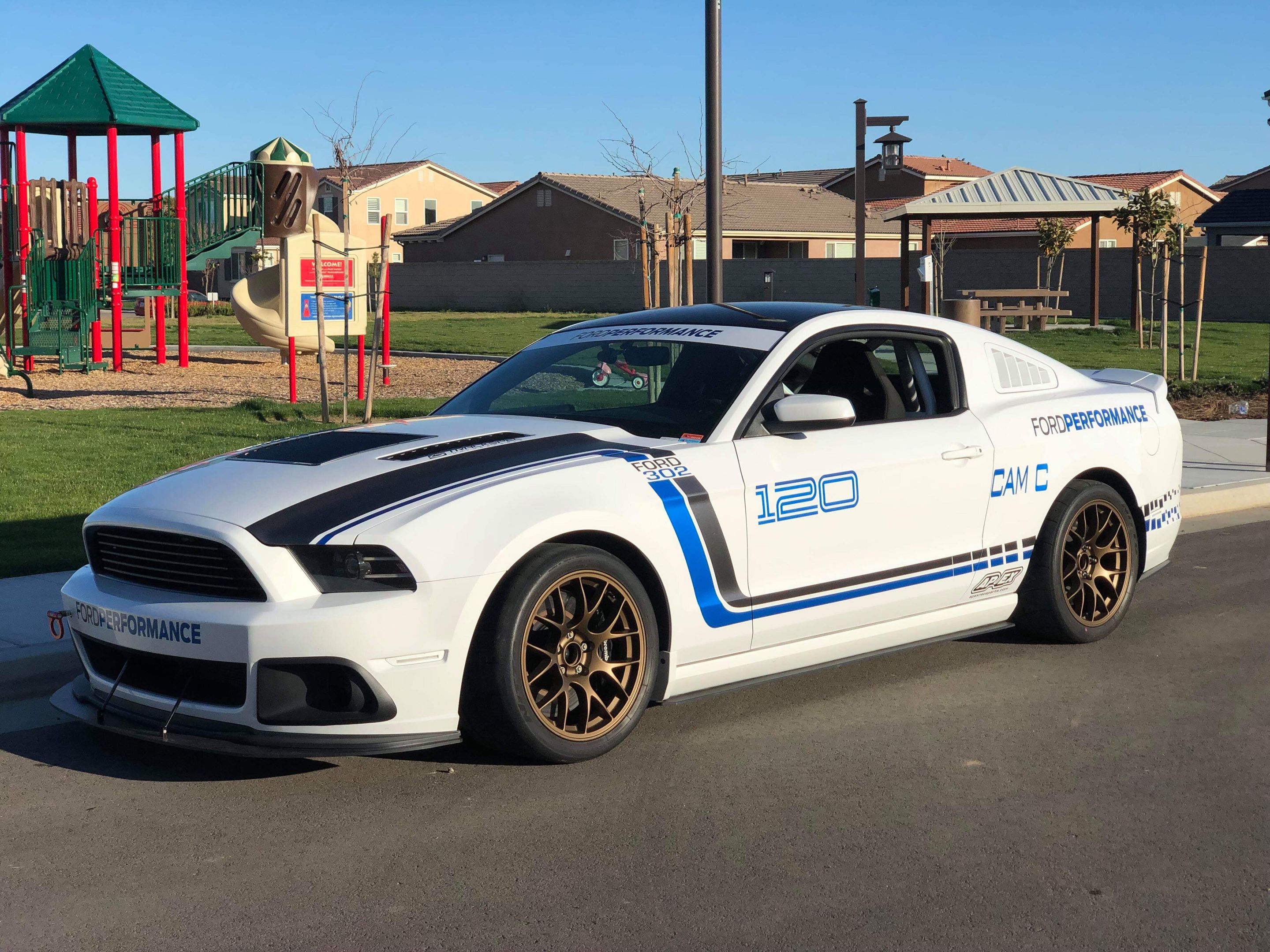 White Ford S197 Mustang GT with 18" EC-7 Apex wheels in Satin Bronze