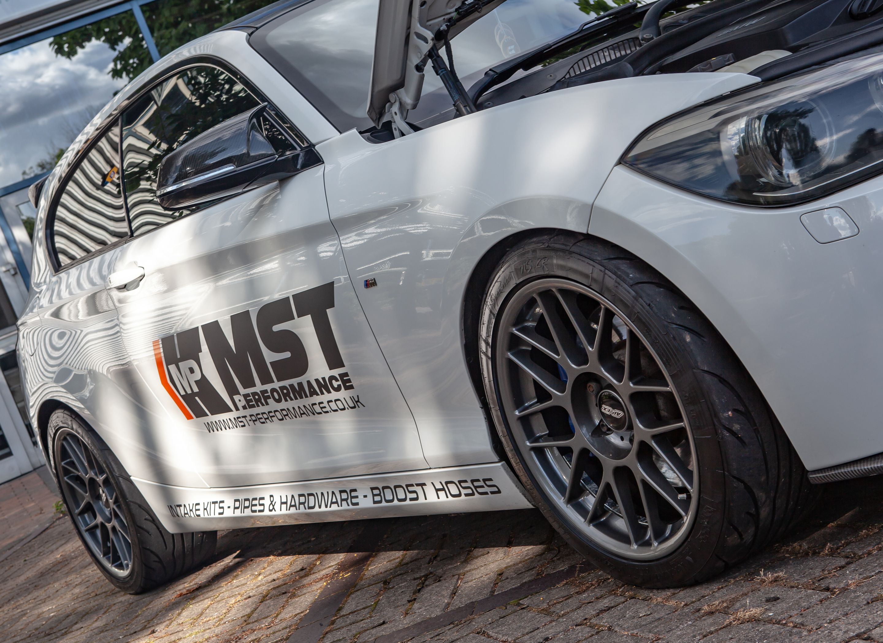 White BMW F21 3 Door Hatchback 1 Series with 18" ARC-8 Apex wheels in Anthracite