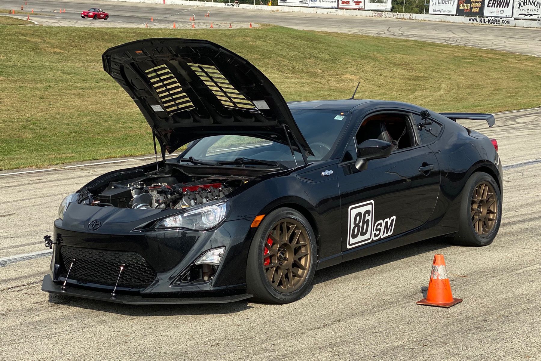 Black Scion FR-S with 17" ARC-8 Apex wheels in Satin Bronze
