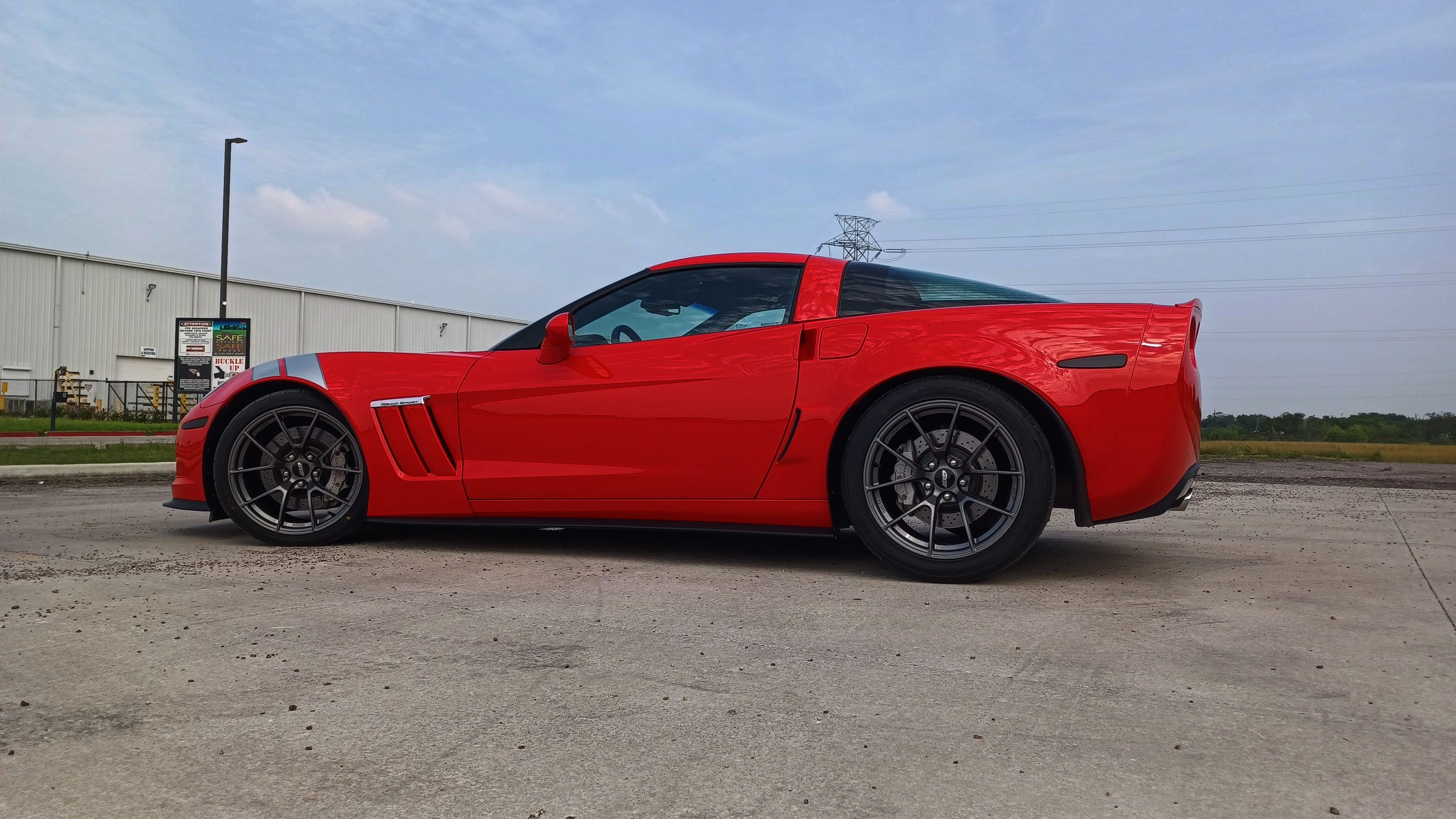 Red Chevrolet C6 Corvette Grand Sport with 19" VS-5RS Apex wheels in Anthracite