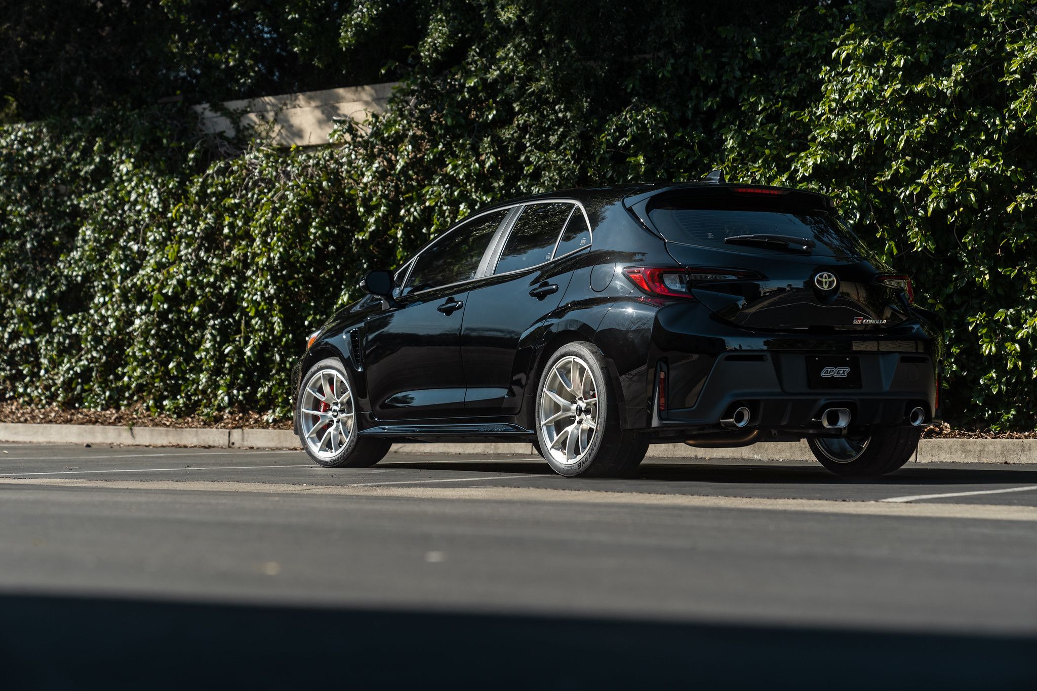 Black Toyota GR Corolla with 18" VS-5RS Apex wheels in Brushed Clear