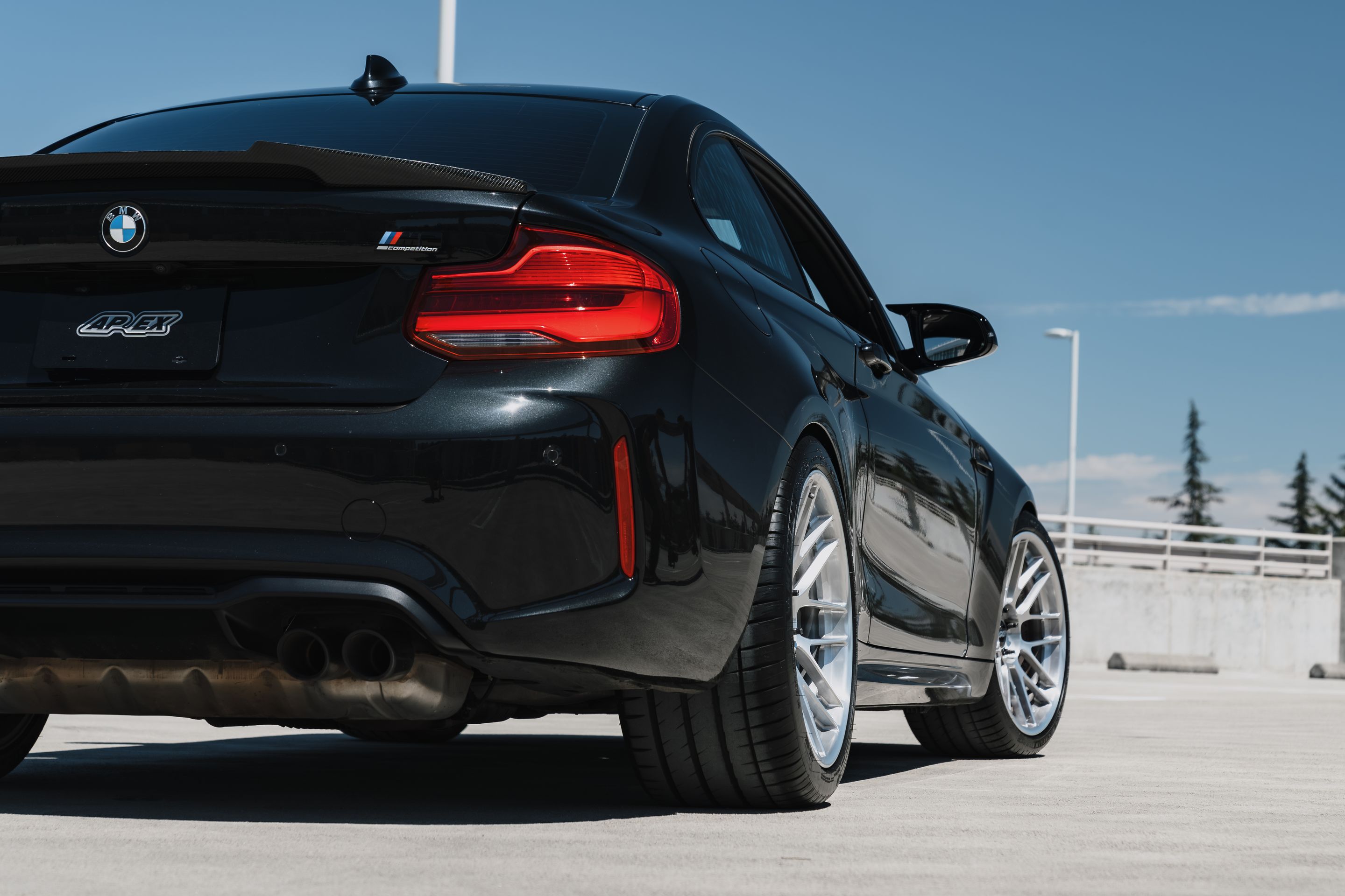 Black BMW F87 M2 with 19" ARC-8RT Apex wheels in Brushed Clear