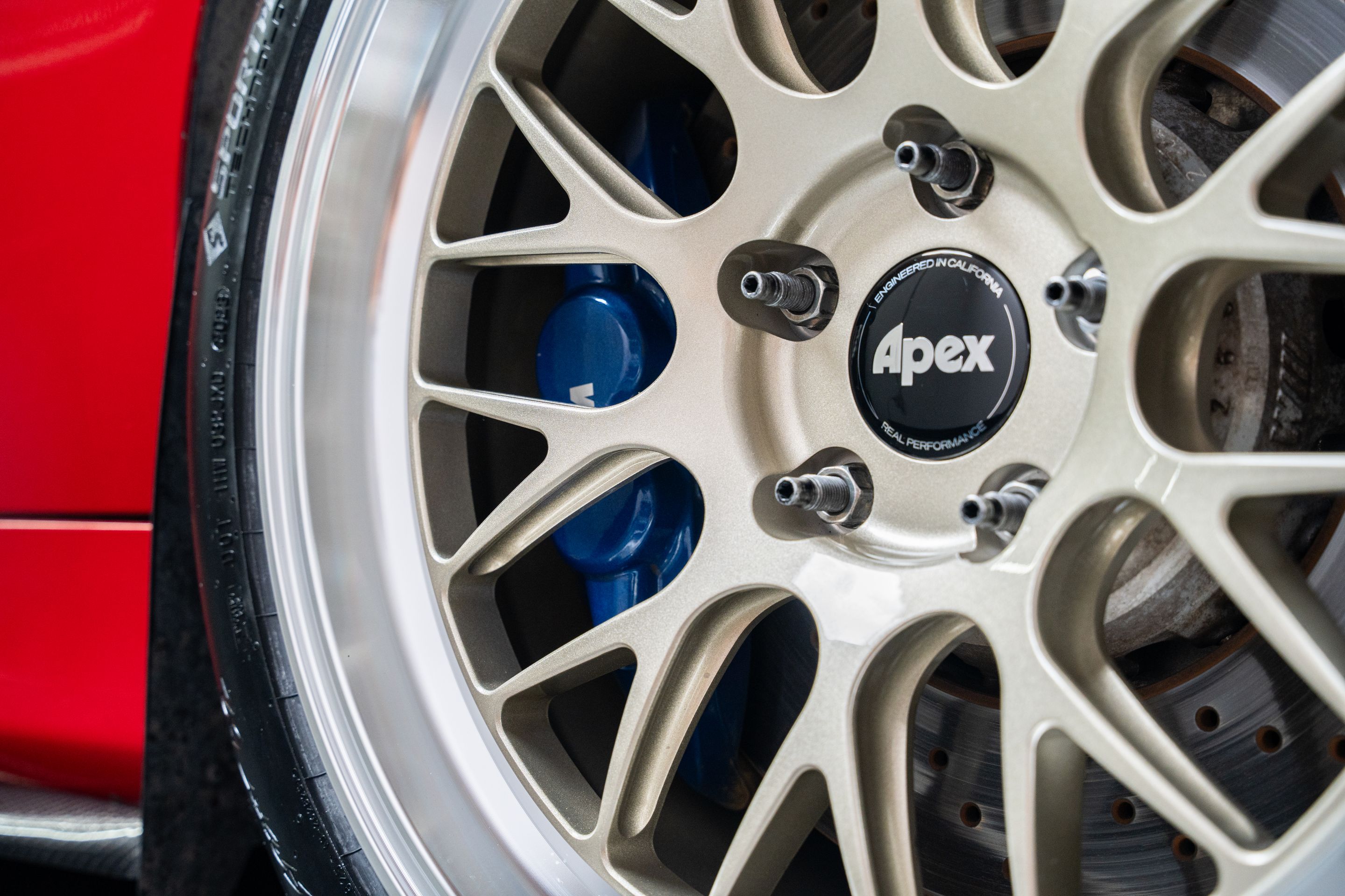 Red BMW E90 Sedan 3 Series with 18" ML-10RT Apex wheels in Machined Lip Gloss Motorsport Gold