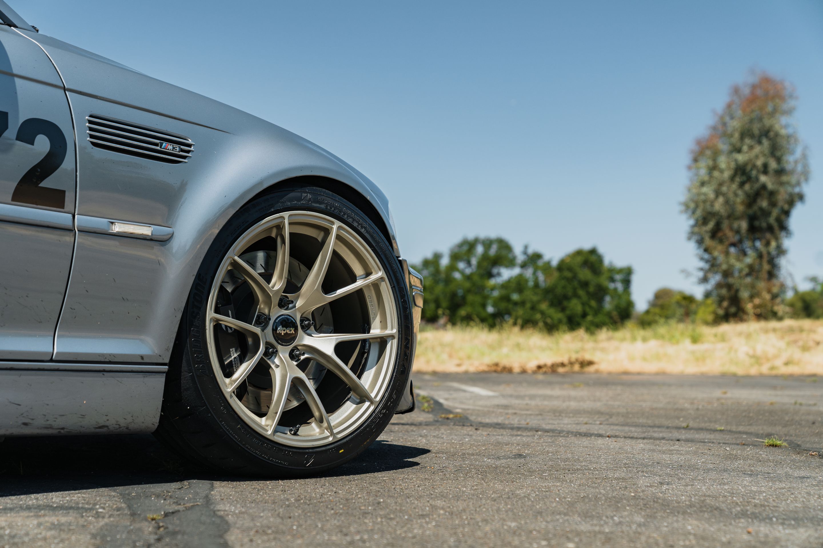 Grey BMW E46 M3 with 18" VS-5RS Apex wheels in Motorsport Gold