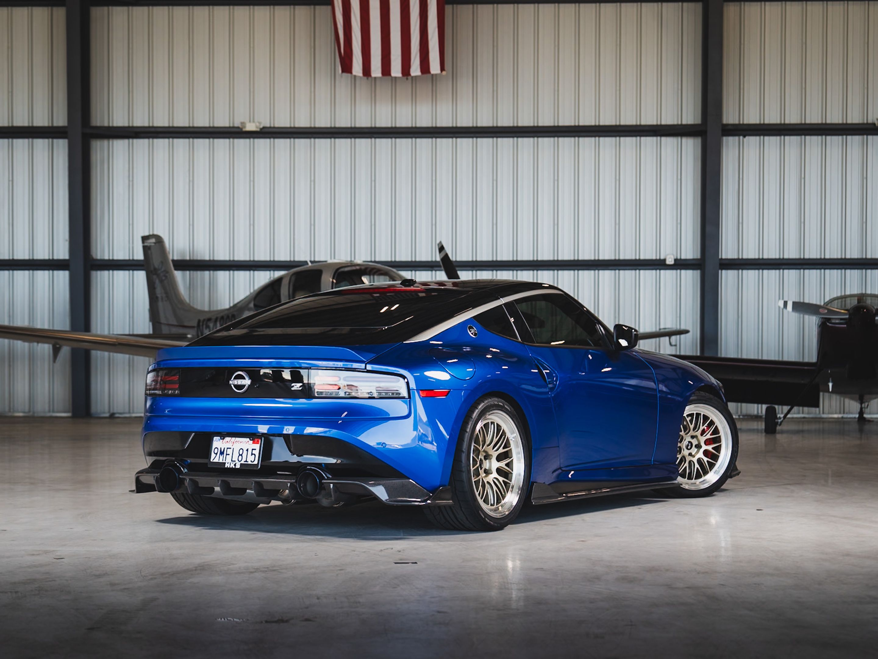 Blue Nissan Z with 19" ML-10RT Apex wheels in Machined Lip Gloss Motorsport Gold