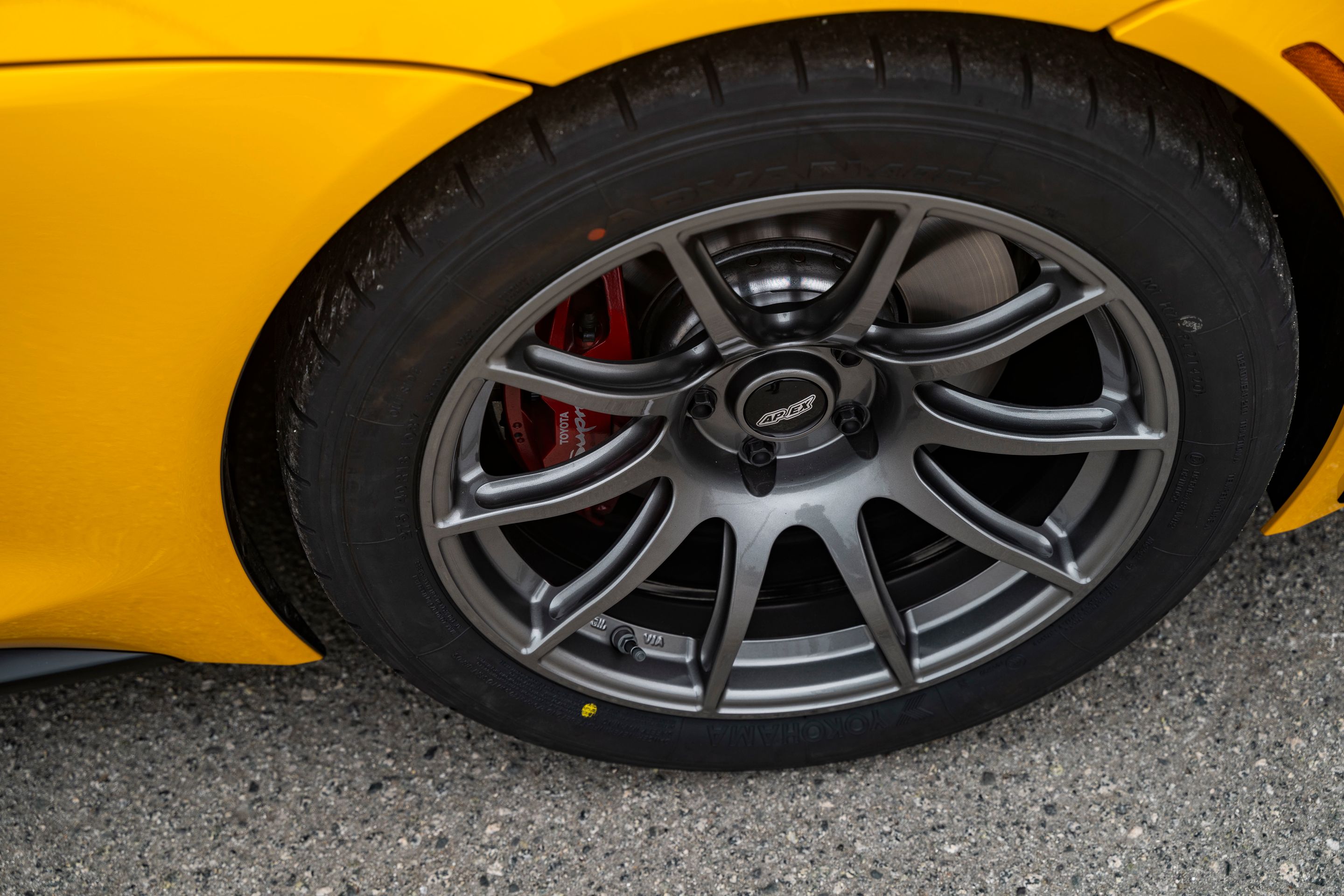 Yellow Toyota GR Supra with 18" SM-10 Apex wheels in Anthracite