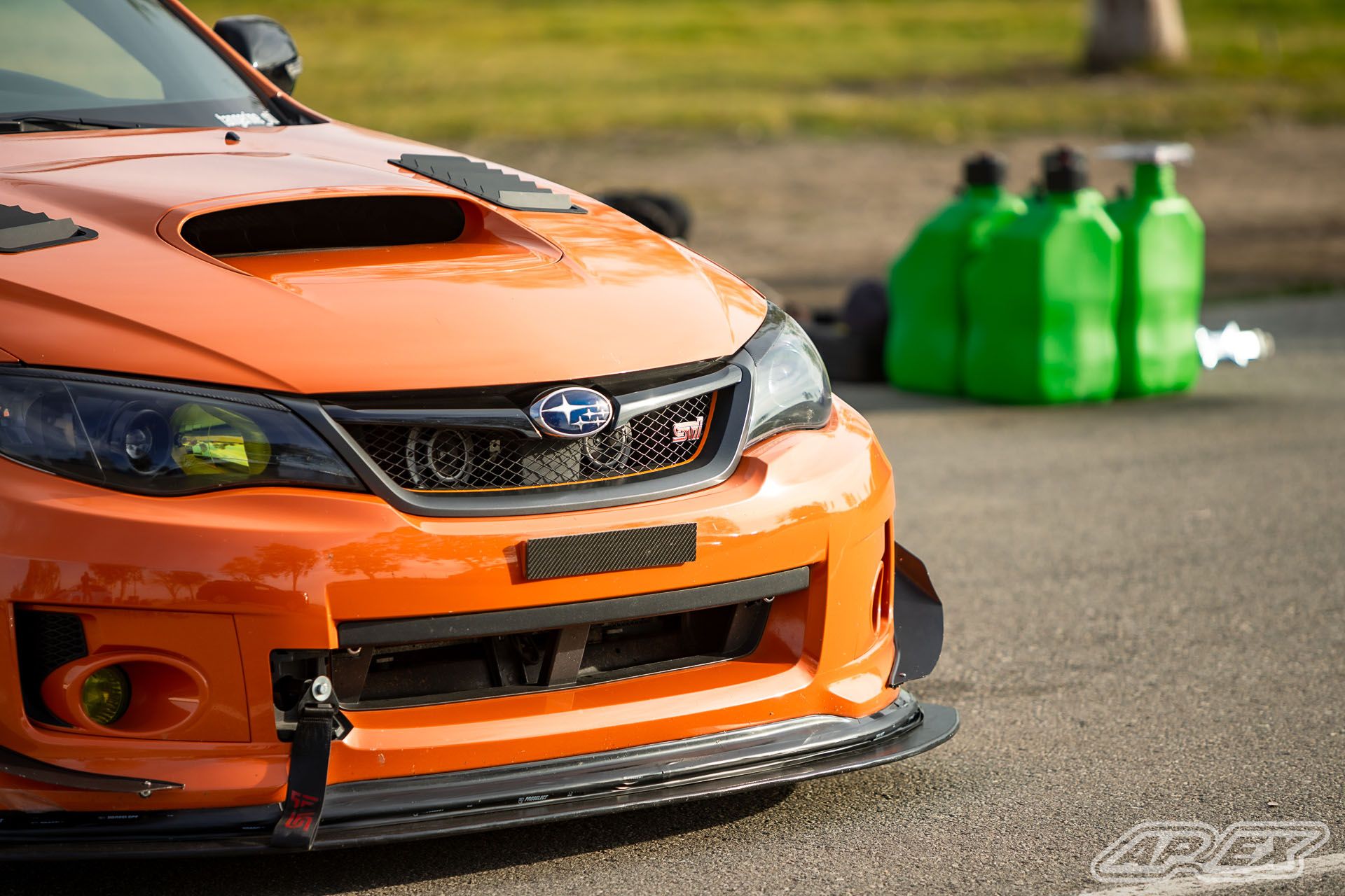 Orange Subaru GR WRX STI with 18" EC-7 Apex wheels in Satin Black