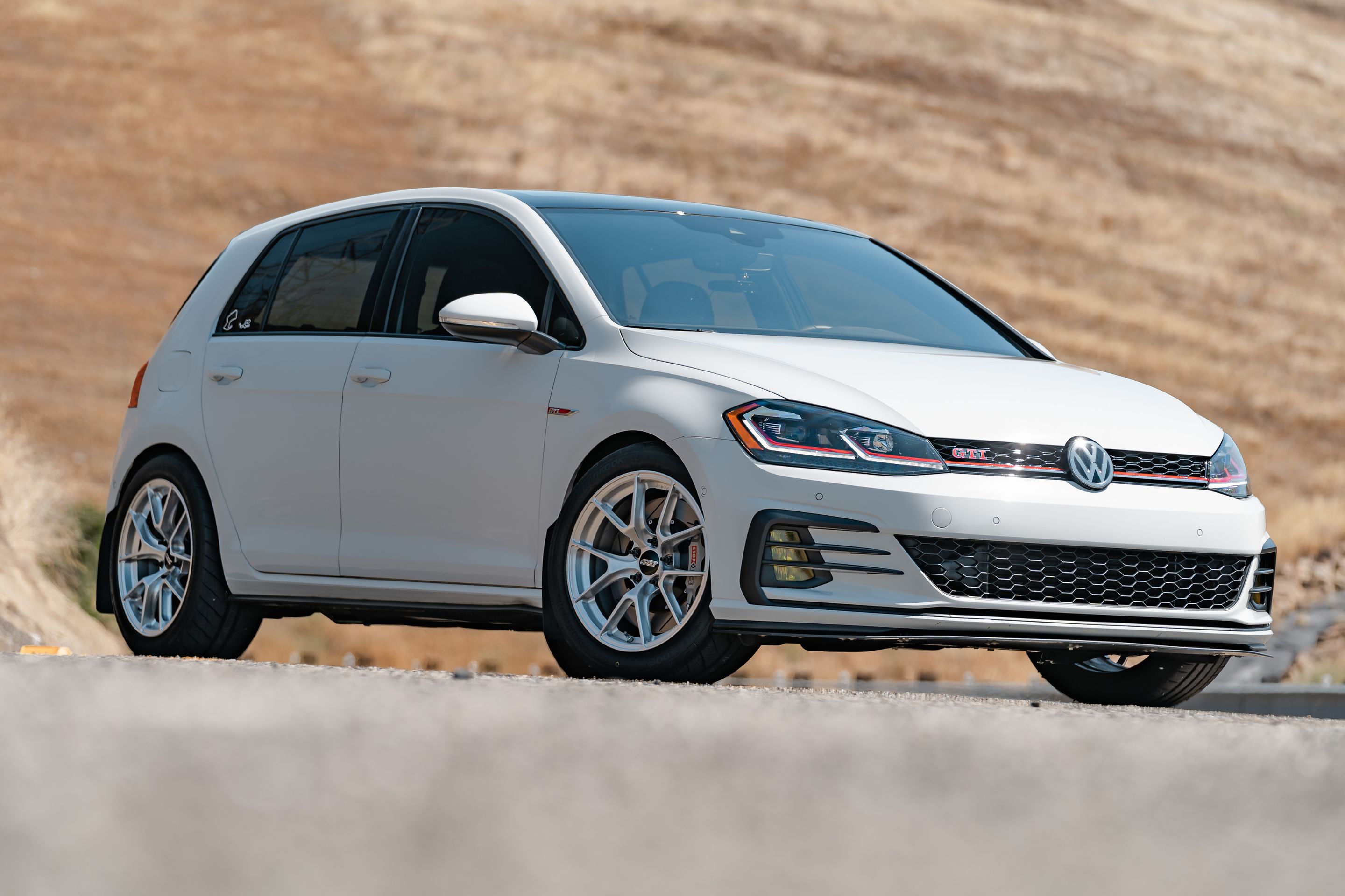 White VW MK7 GTI with 17" VS-5RS Apex wheels in Brushed Clear
