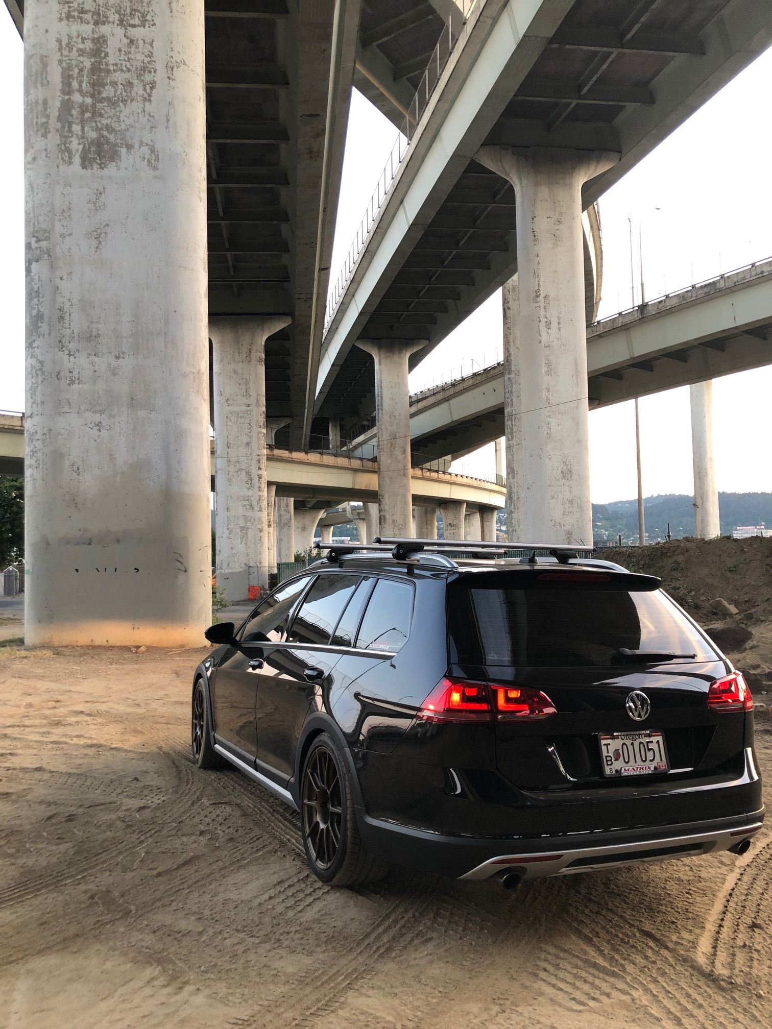 Black VW MK7 Alltrack/SportWagen Alltrack with 18" SM-10 Apex wheels in Satin Bronze