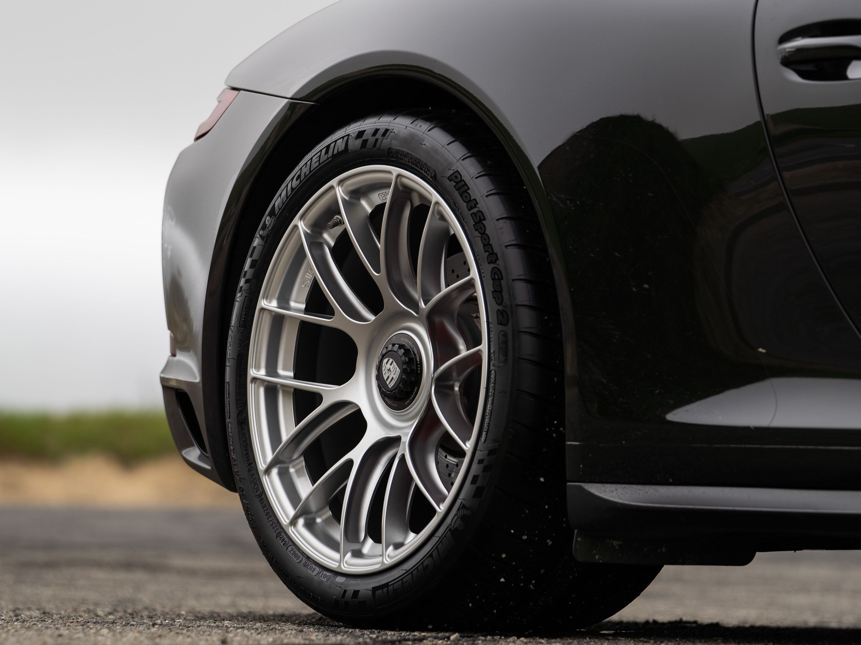 Black Porsche 911 991.2 Carrera GTS with 19" EC-7RS Apex wheels in Race Silver