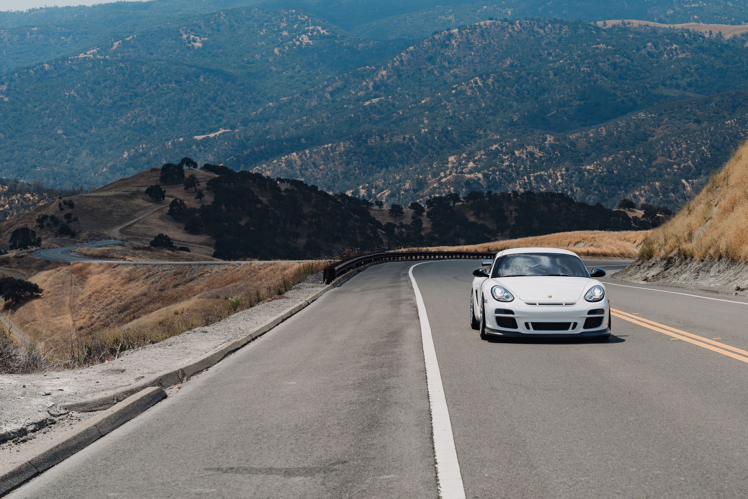 White Porsche 987 Cayman R with 18" EC-7RS Apex wheels in Race Silver